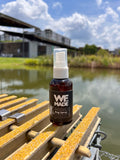 Small 2 oz. bottle of WE Made bug spray with clear label and spray nozzle, designed for effective insect protection.