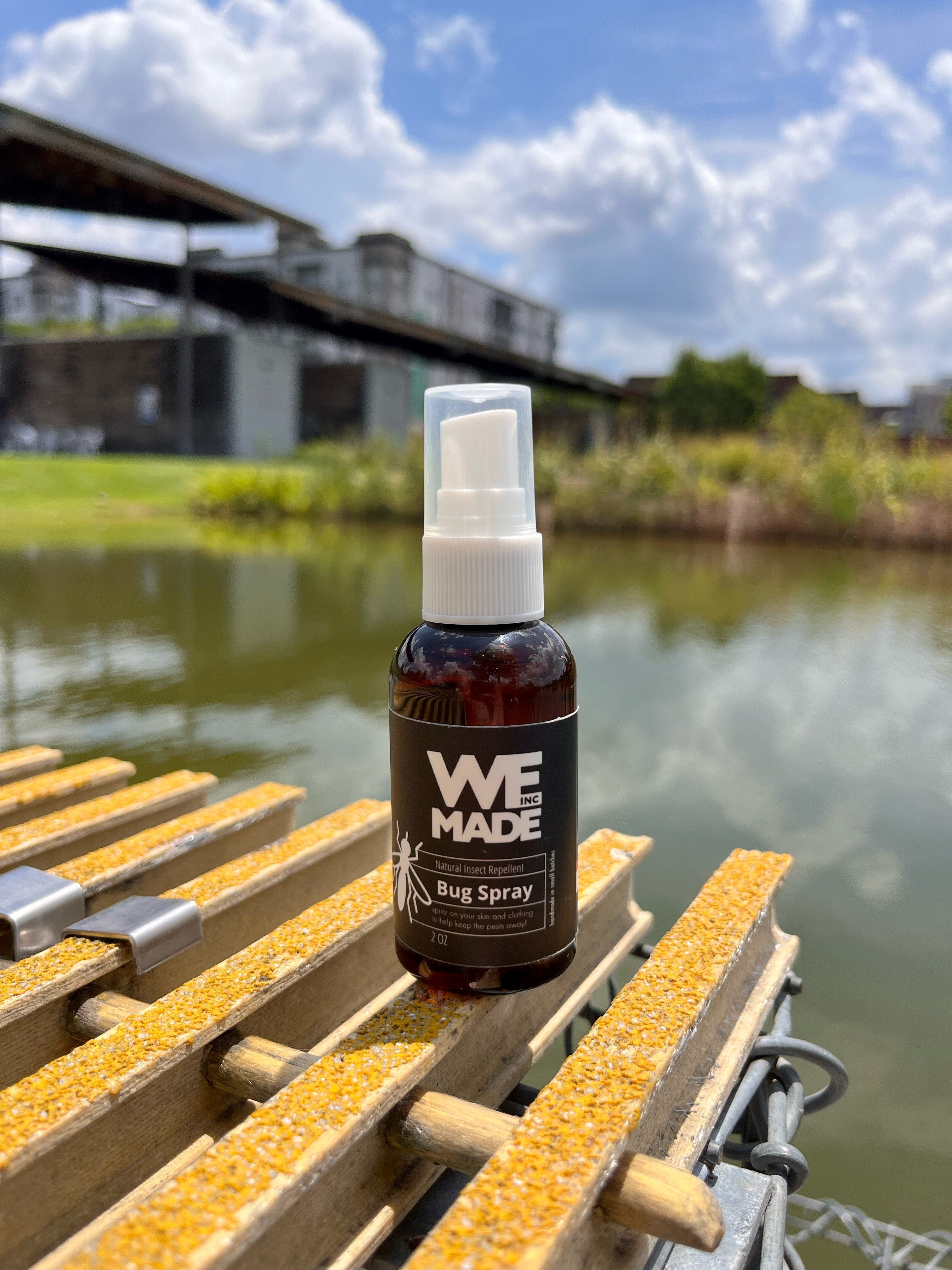 Small 2 oz. bottle of WE Made bug spray with clear label and spray nozzle, designed for effective insect protection.