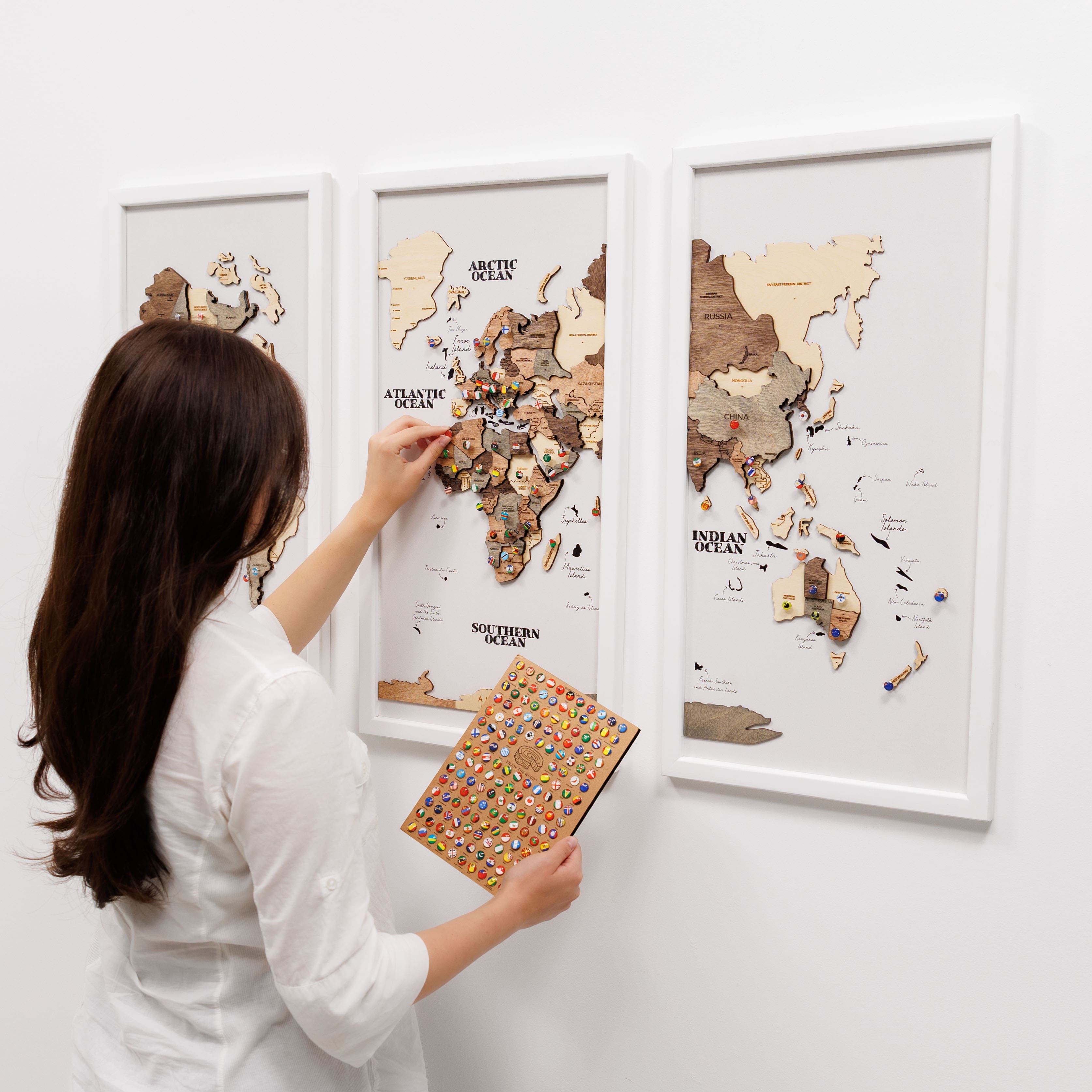 Wooden triptych wall art featuring a smokey finish with a detailed wooden world map by Enjoy The Wood.