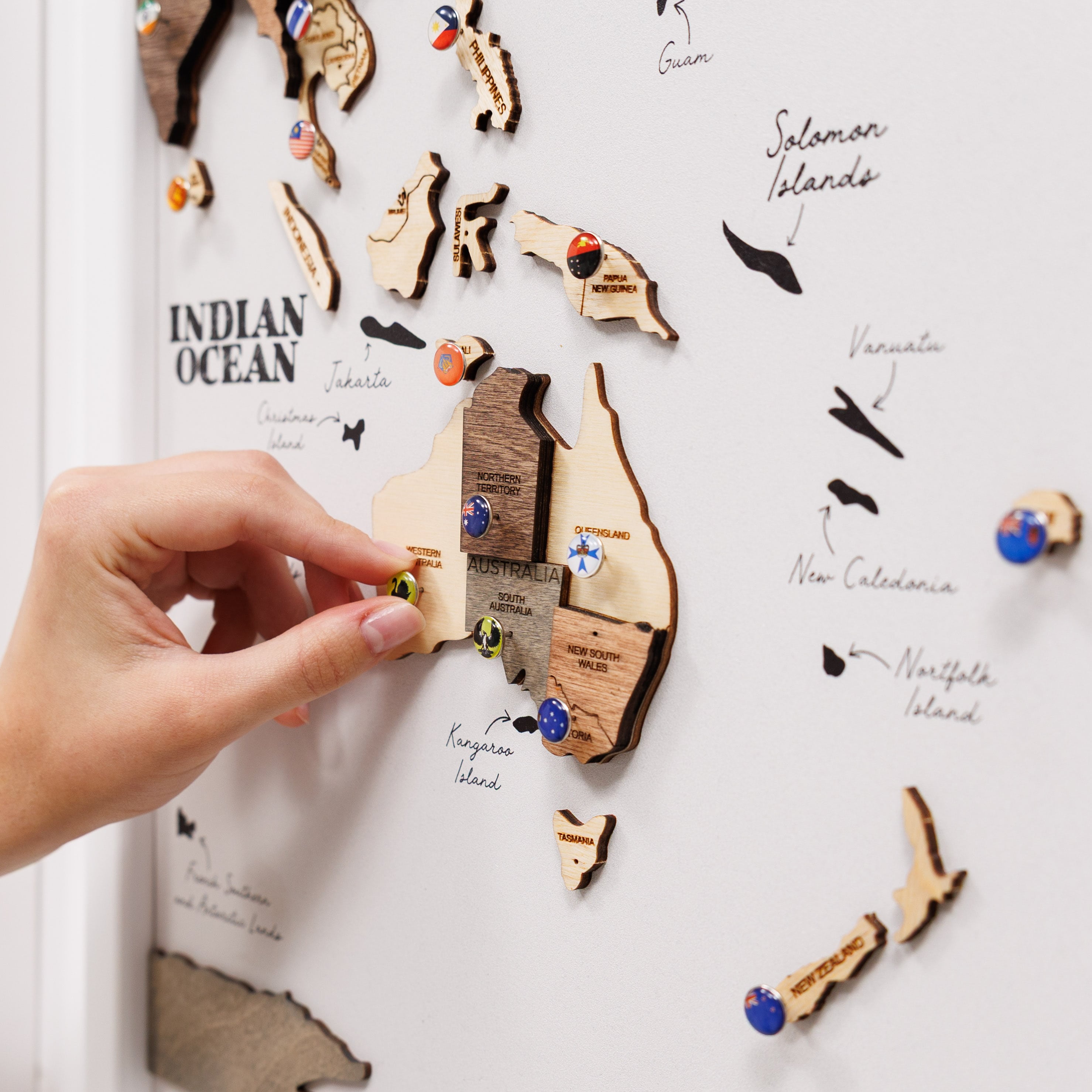 Wooden triptych wall art featuring a smoky finish, designed as a wooden world map by Enjoy The Wood.