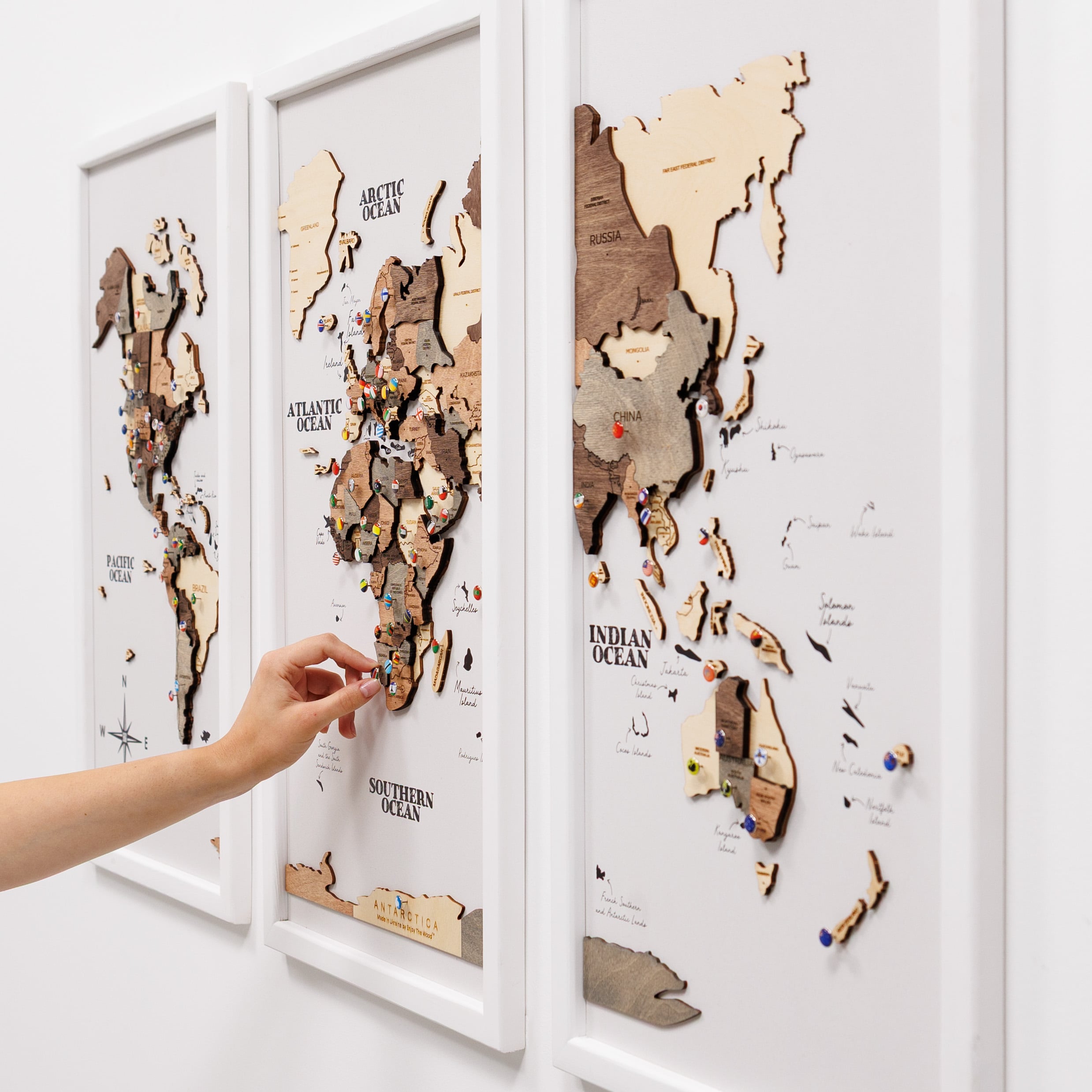 Wooden triptych wall art featuring a smokey finish with a detailed wooden world map by Enjoy The Wood.