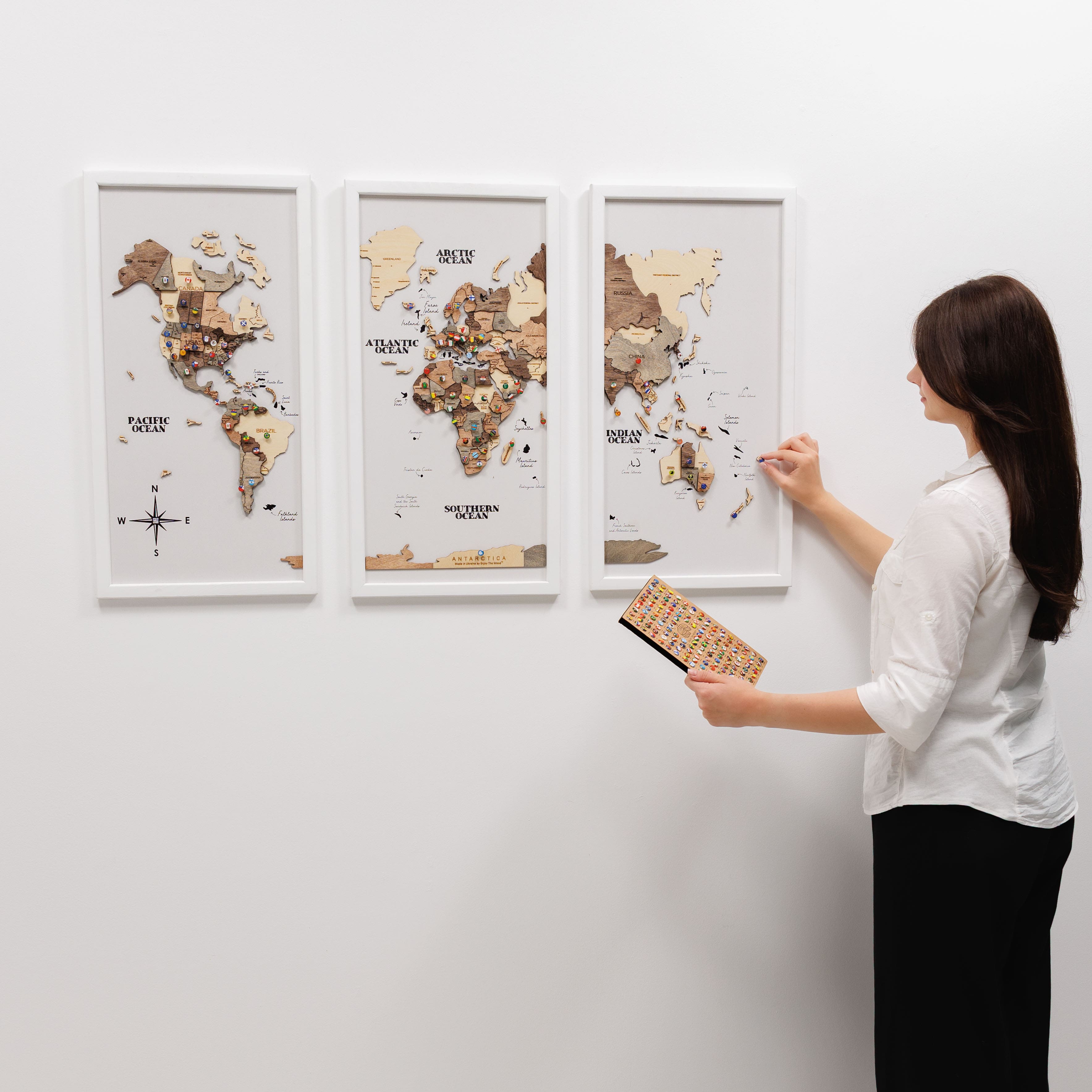 Wooden triptych wall art featuring a smoky finish and a detailed world map by Enjoy The Wood, designed for elegant wall decor.