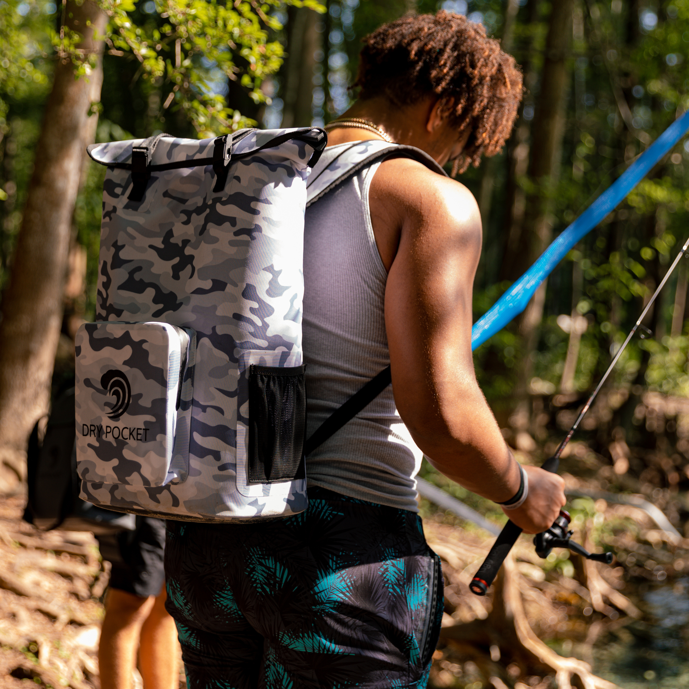 Snow camo Dry Pocket waterproof floating backpack cooler with insulated interior and adjustable straps.