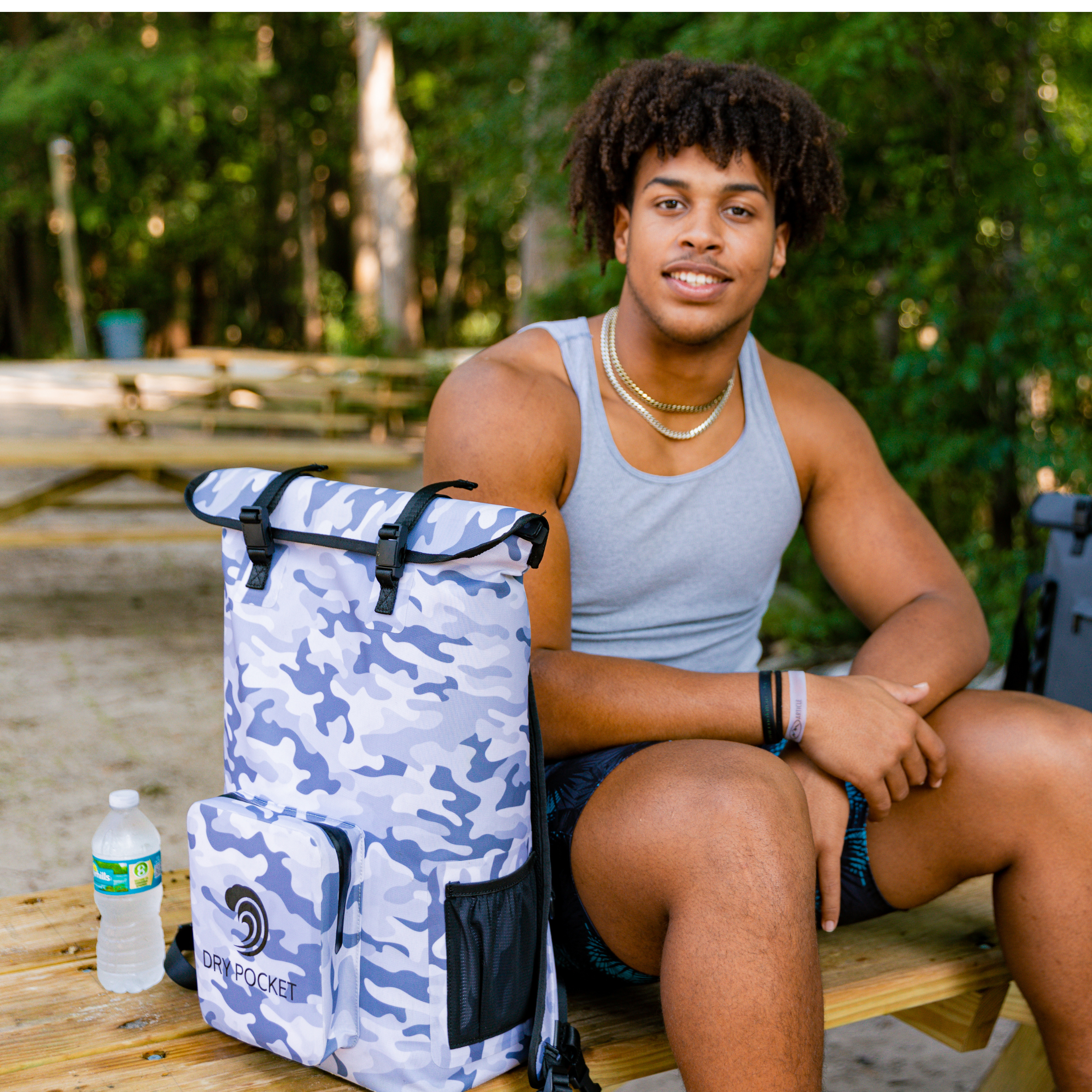 Snow camo waterproof floating backpack cooler by Dry Pocket with insulated interior and adjustable straps for outdoor adventures.