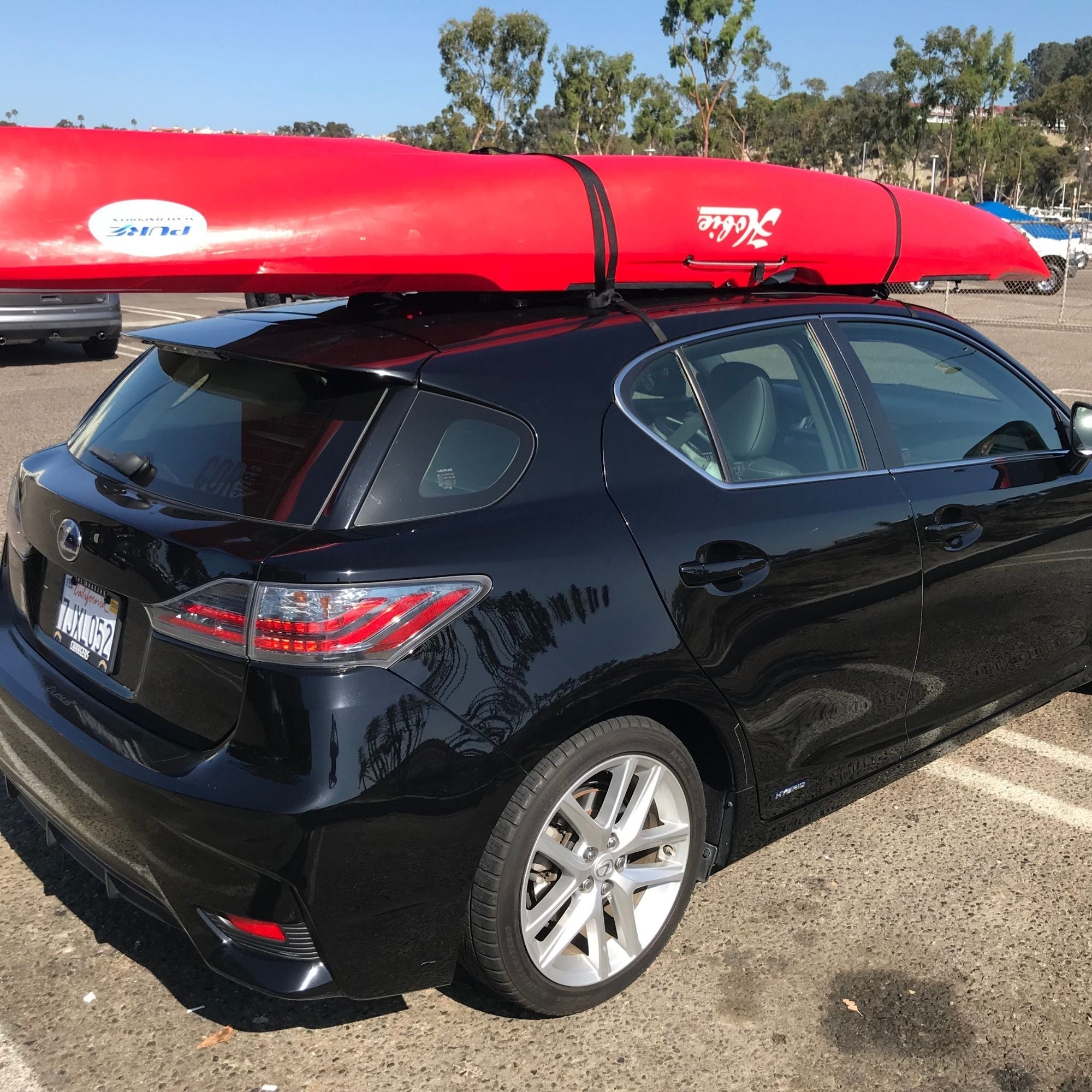 COR Surf soft car racks for universal roof mounting, designed to secure surfboards, SUPs, canoes, or kayaks on vehicle roofs.