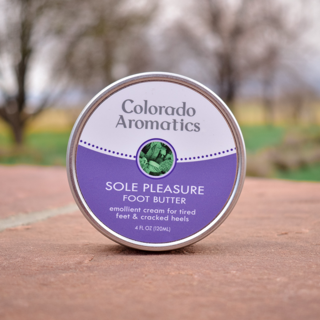 Colorado Aromatics Sole Pleasure Foot Butter balm in a jar, showing the creamy, soothing foot moisturizer for soft, healthy feet.