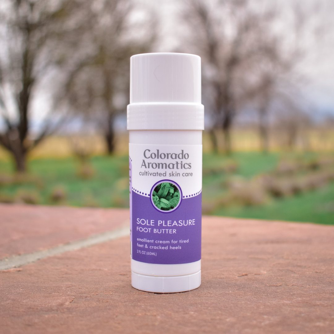 Sole Pleasure Foot Butter Balm tube by Colorado Aromatics, moisturizing foot butter product with a sleek packaging design.