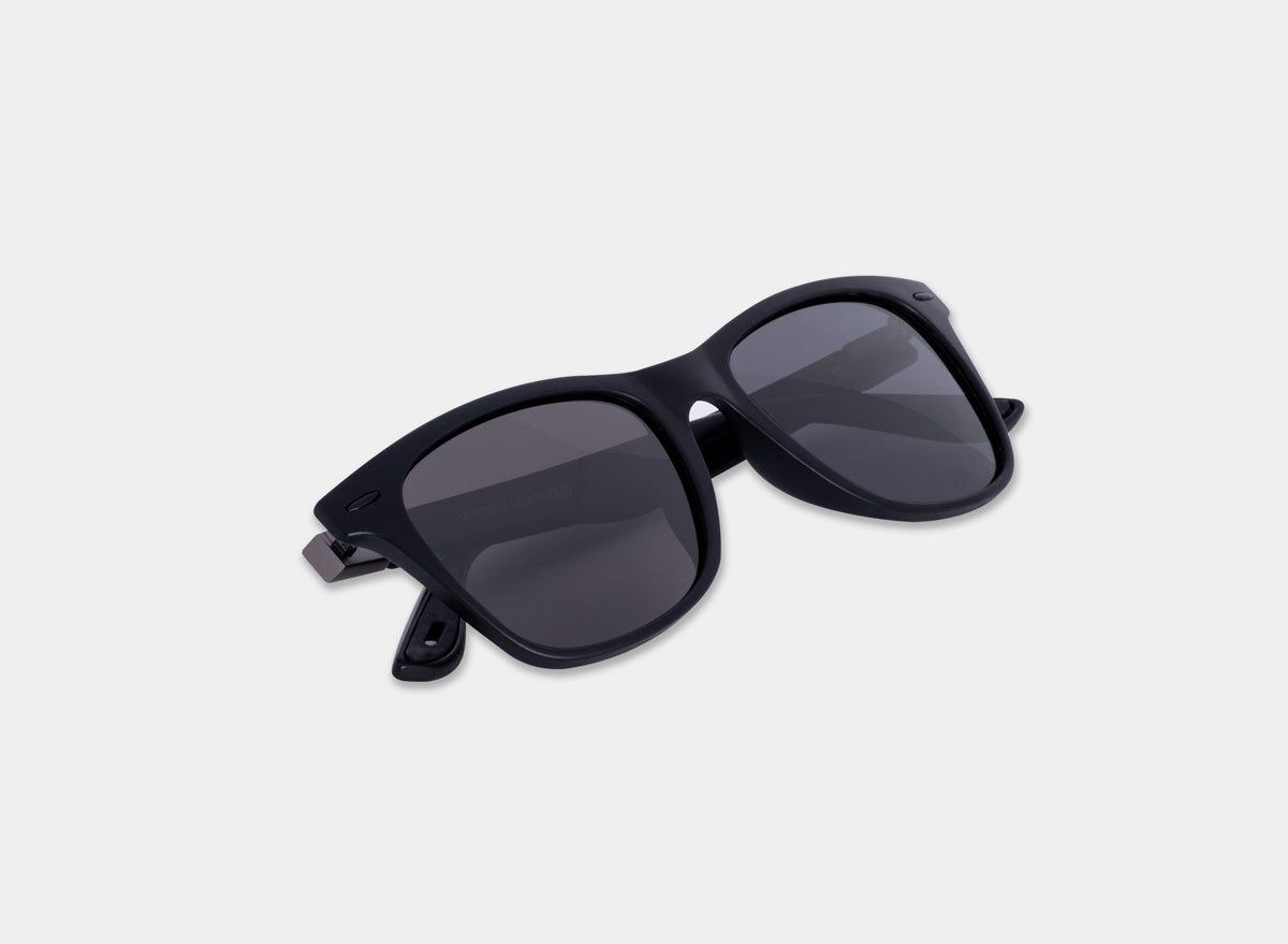 Black sport sunglasses by Eastern Outer with sleek frame and tinted lenses, ideal for active outdoor activities.