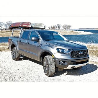 Backcountry Sportsman Tuff Truck Rack with loading bars on a Toyota Tacoma, showing sturdy steel construction and secure mounting.