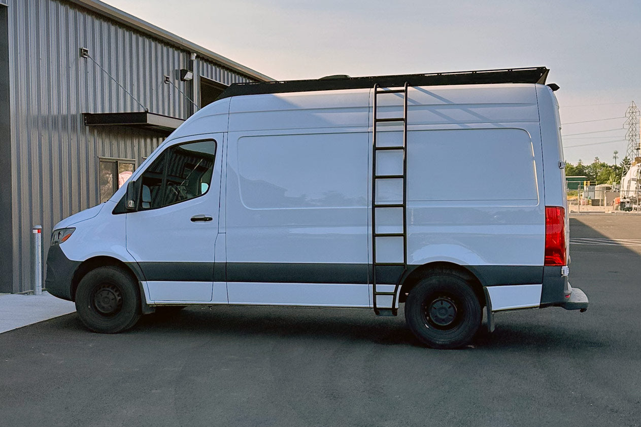 Orion Van Gear Sprinter Wheel Wrap Side Ladder with flat step design, mounted on a van roof rack for easy roof access.
