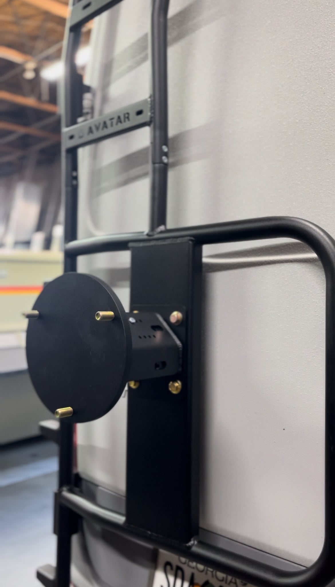 Avatar Offroad rear ladder tire carrier mount attached to a vehicle, providing secure tire storage for off-road adventures.