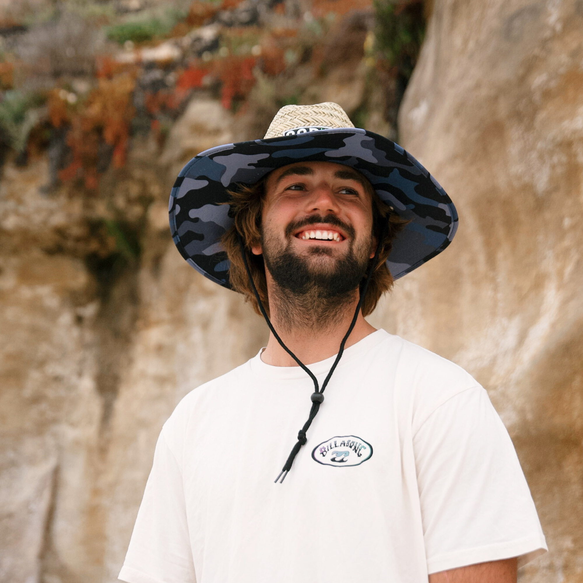 Men's straw beach hat in blue camouflage pattern by COR Surf, featuring a wide brim for sun protection and casual style.