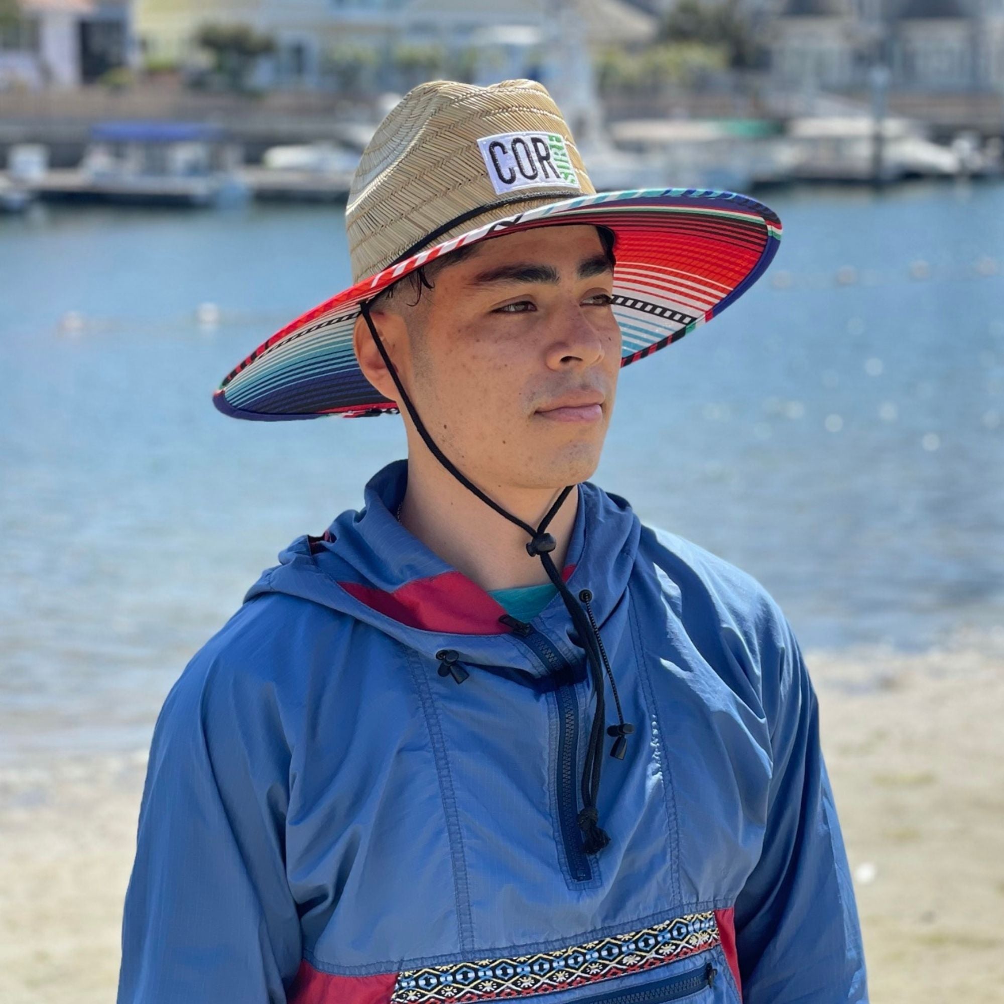 COR Surf straw Lifeguard sun beach hat for adults, featuring wide brim and breathable woven straw design for sun protection.