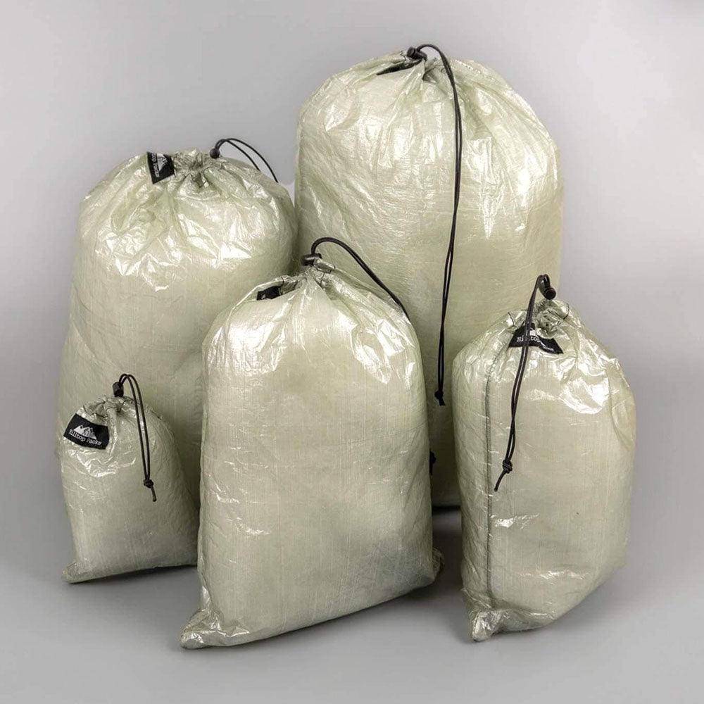 Ultralight Dyneema stuff sacks from Hilltop Packs LLC, showing compact, durable storage bags with drawstring closures.