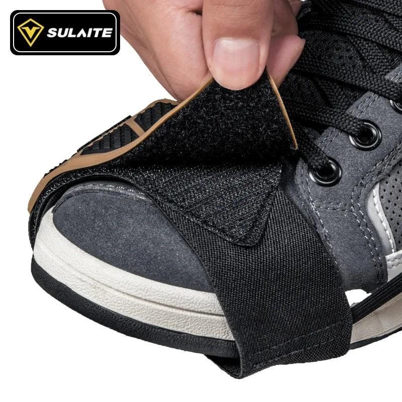 Bean's Moto Booth SULAITE™ motorcycle gear shift pad and shoe protector on black motorcycle boots for gear shifting.