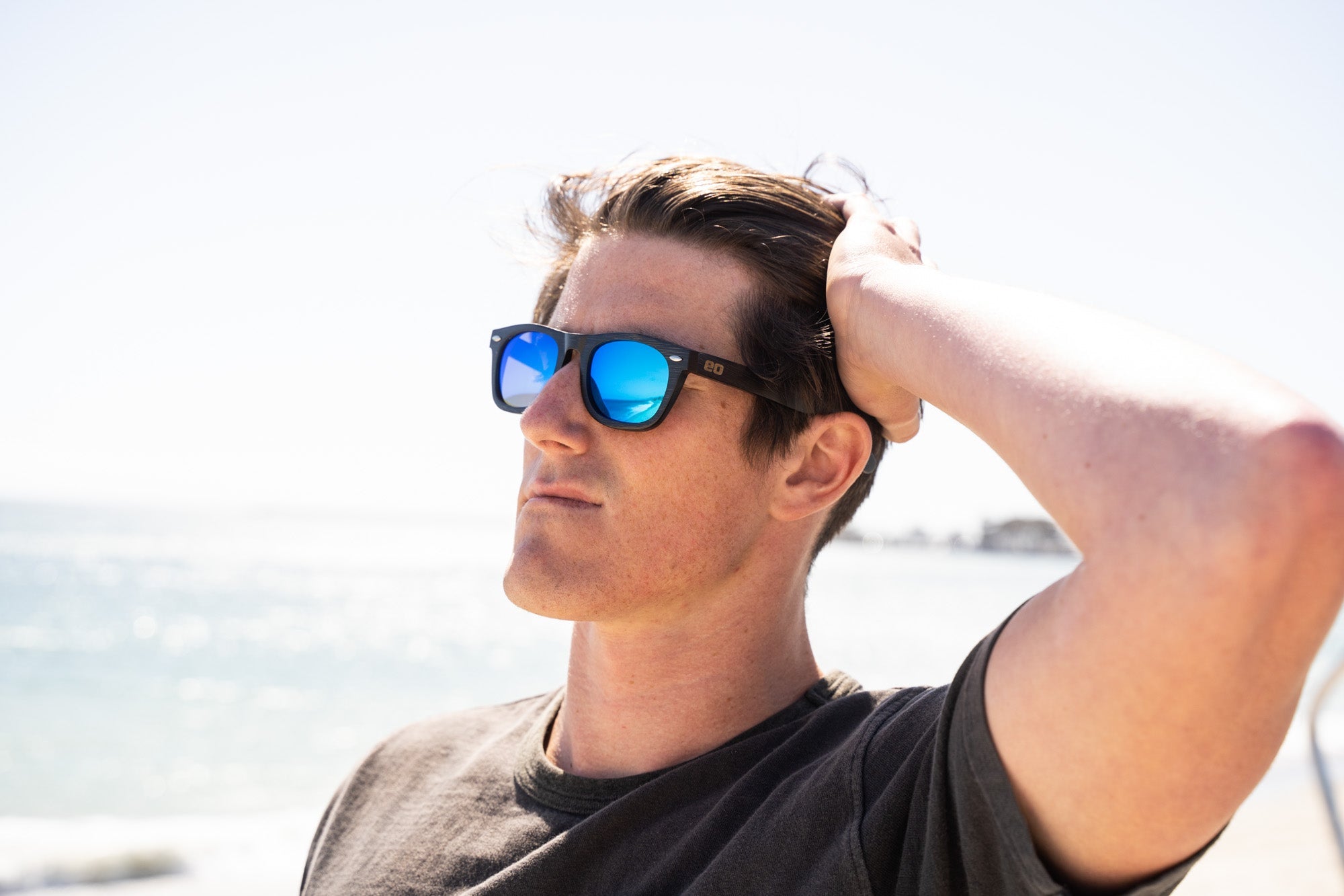 Bamboo floating sunglasses by Eastern Outer with round frames and polarized lenses, suited for outdoor water activities.