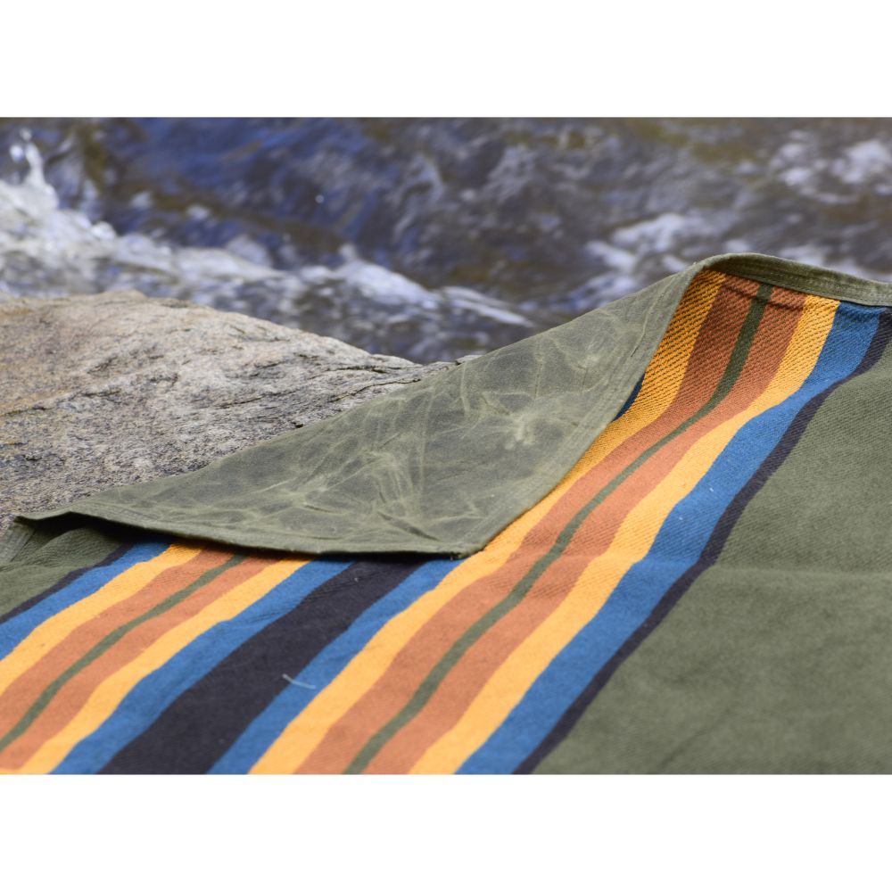 West Path waxed canvas camping blanket, outdoor throw blanket with rugged surface, ideal for camping and bushcraft activities.