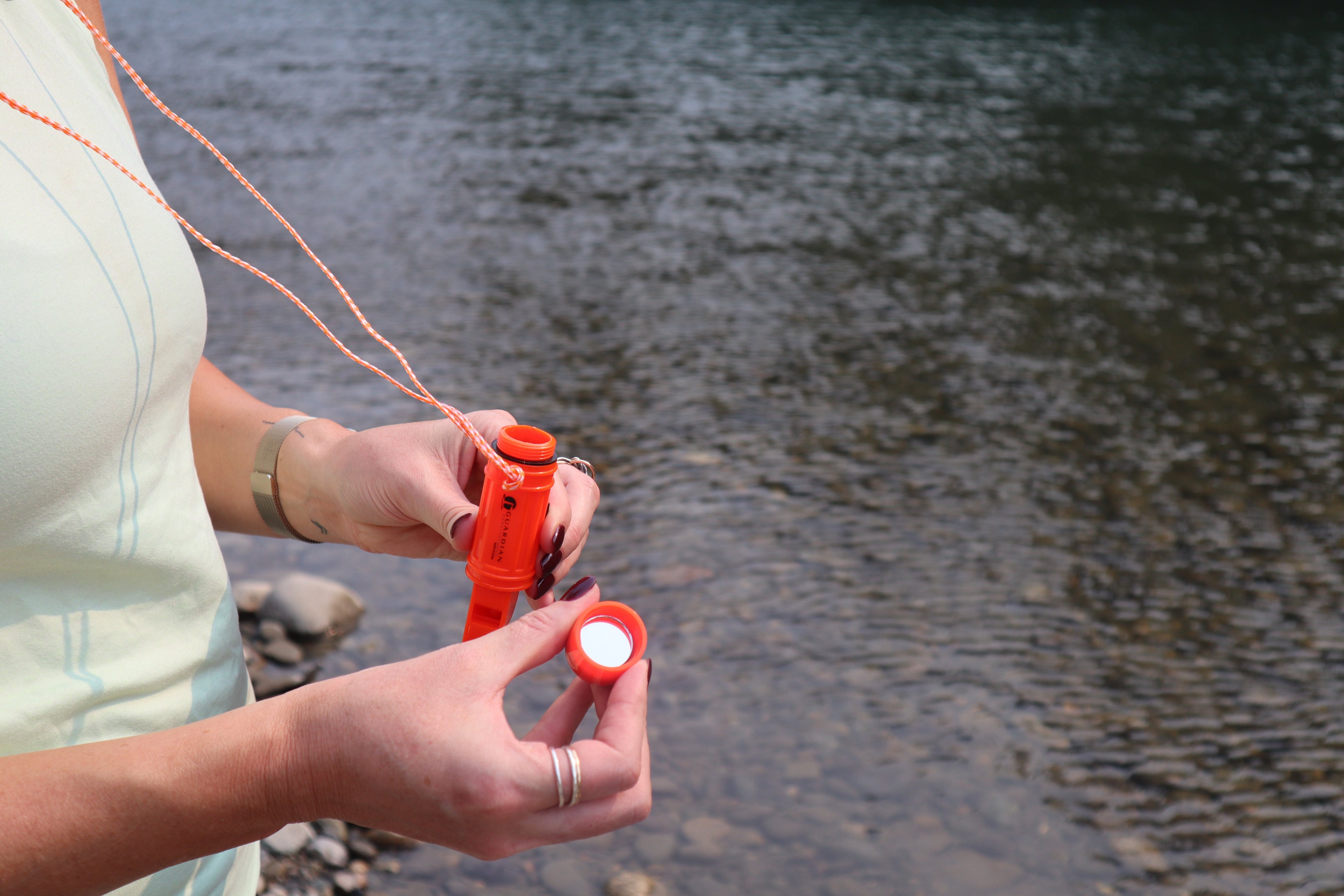 5-in-1 survival whistle with compass and waterproof container, featuring a compact outdoor tools kit for emergency use.