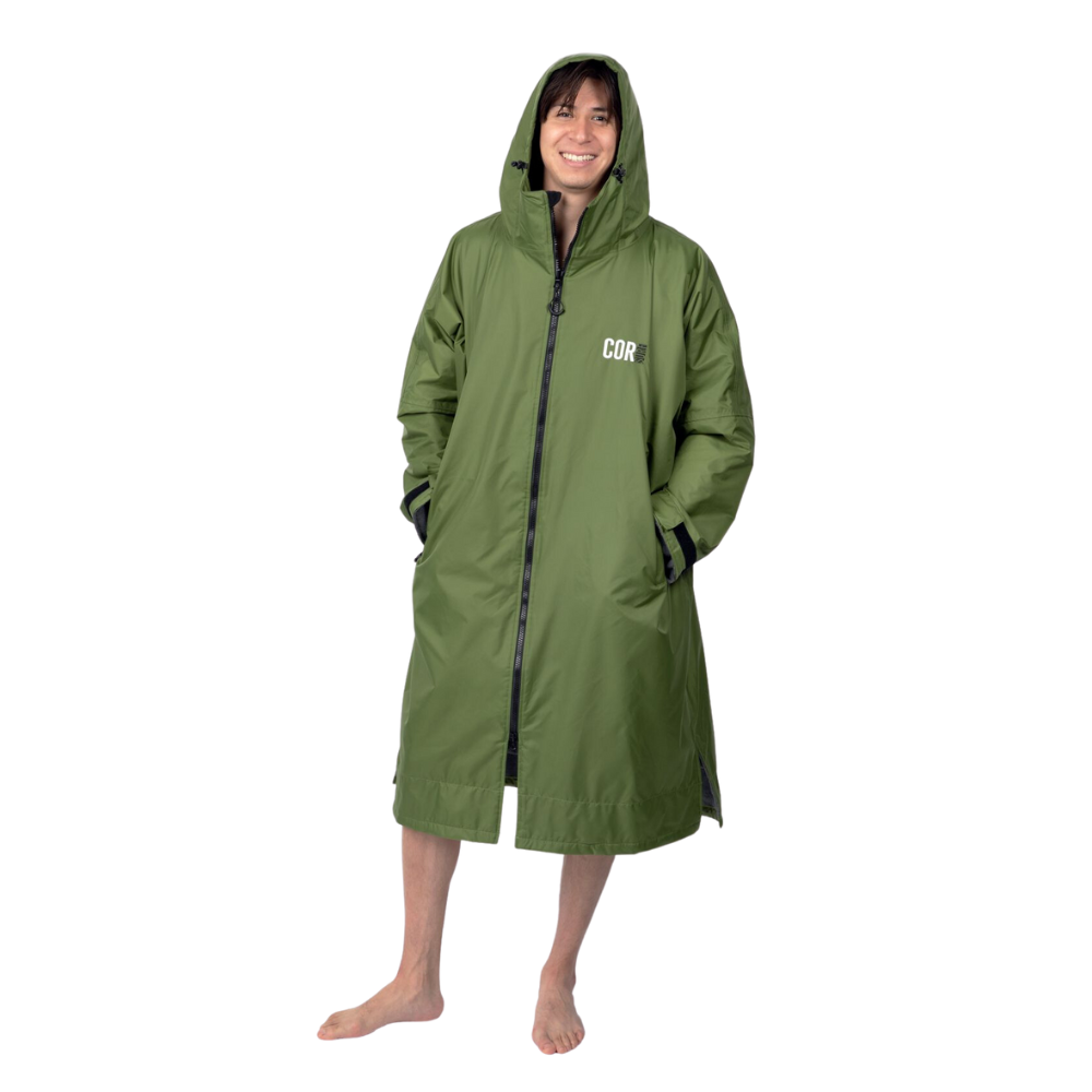 COR Surf men's waterproof swim parka in green with a large hood, designed for outdoor water activities and beach wear.