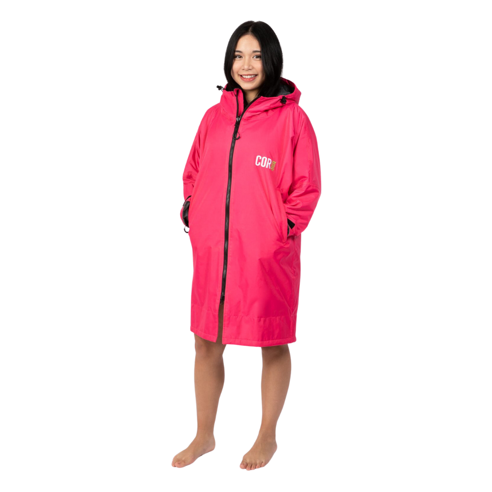 Pink waterproof swim parka jacket by COR Surf, suitable for youth, kids, girls, and adults, designed for water activities and protection.