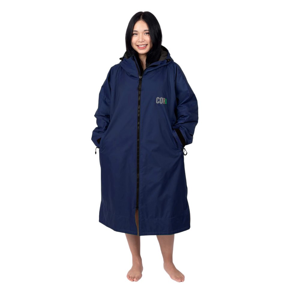 Navy blue waterproof swim parka jacket by COR Surf, designed for women and men, with a lightweight, protective waterproof fabric.