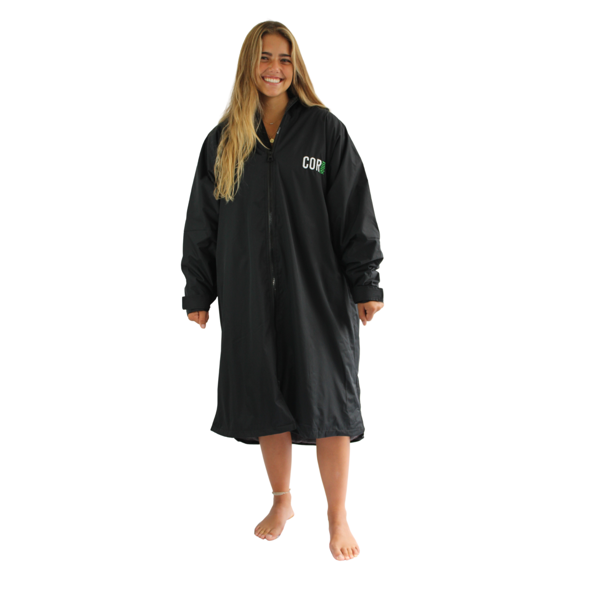 Black waterproof swim parka jacket by COR Surf, XS-XL size, shown with towel, ideal for beach and water activities.