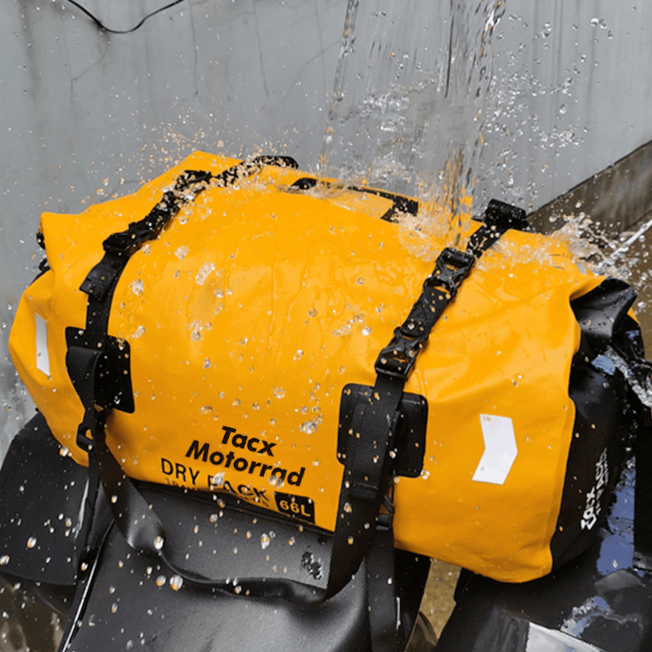 Bean's Moto Booth TACX™ 4-in-1 waterproof motorcycle tailbag showing adjustable straps and multiple compartments on a motorcycle.