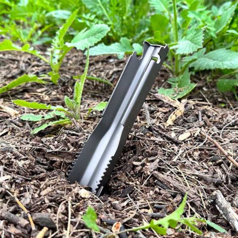 Near Zero Outdoor Gear titanium digging trowel with ergonomic handle, ideal for gardening and outdoor digging tasks.