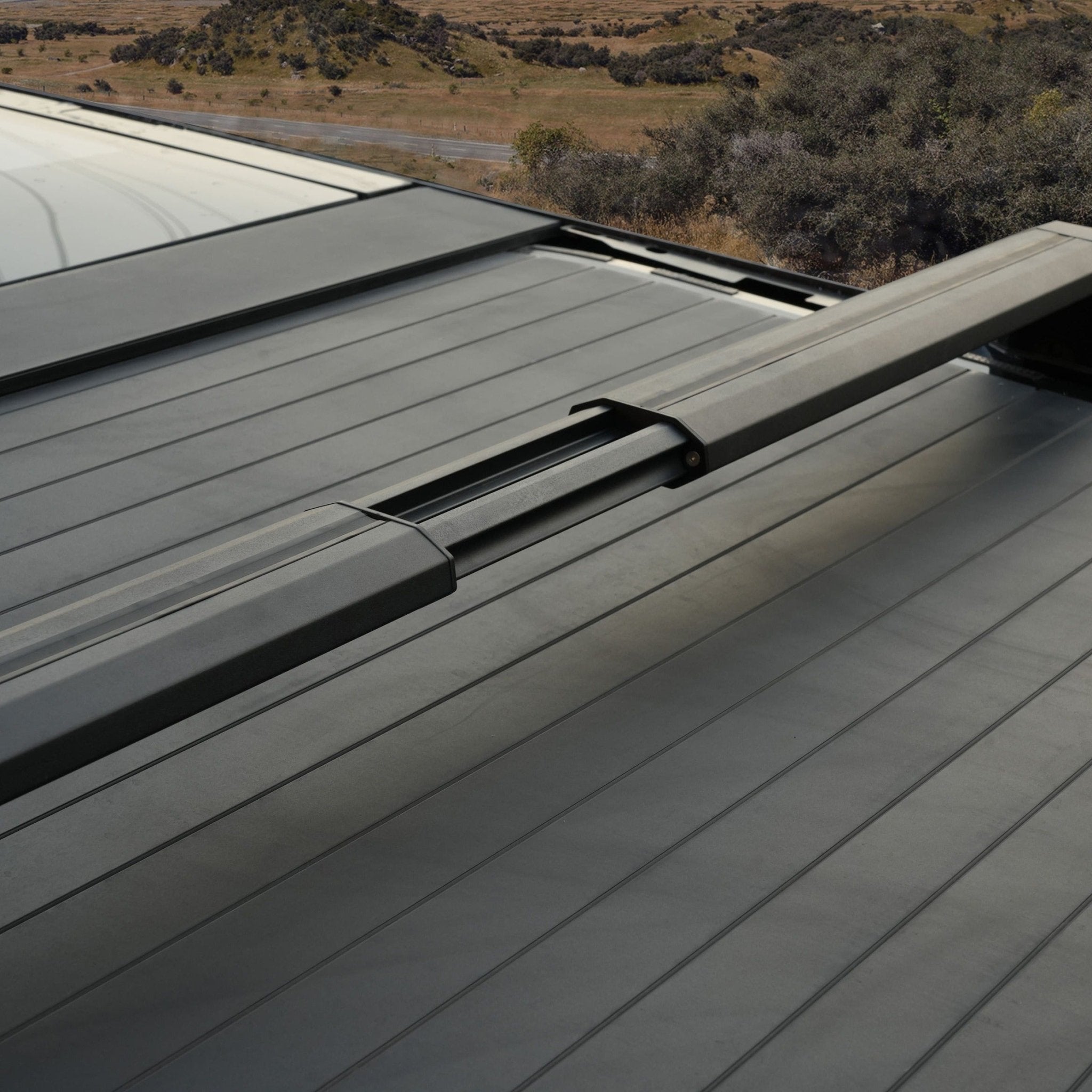 Tesla Cybertruck adjustable crossbar roof rack carrier by CyberGearco with secure mounting and cargo space for outdoor gear.