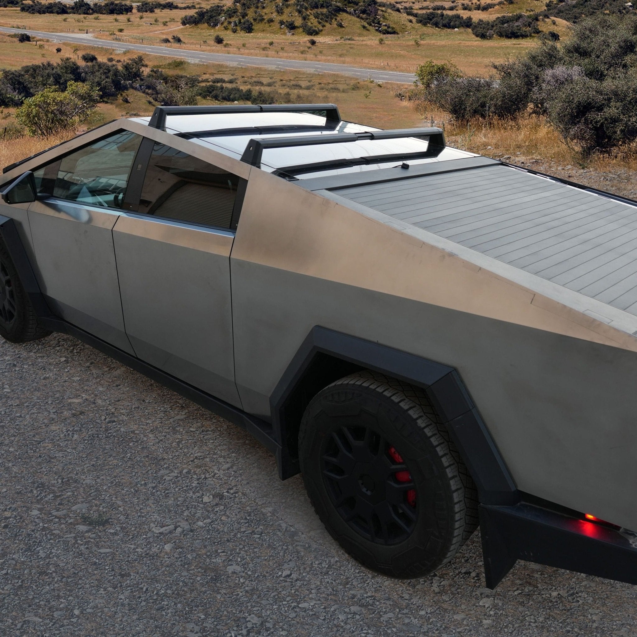 Tesla Cybertruck adjustable crossbar roof rack cargo carrier by CyberGearco, mounted on the vehicle for secure outdoor gear transport.