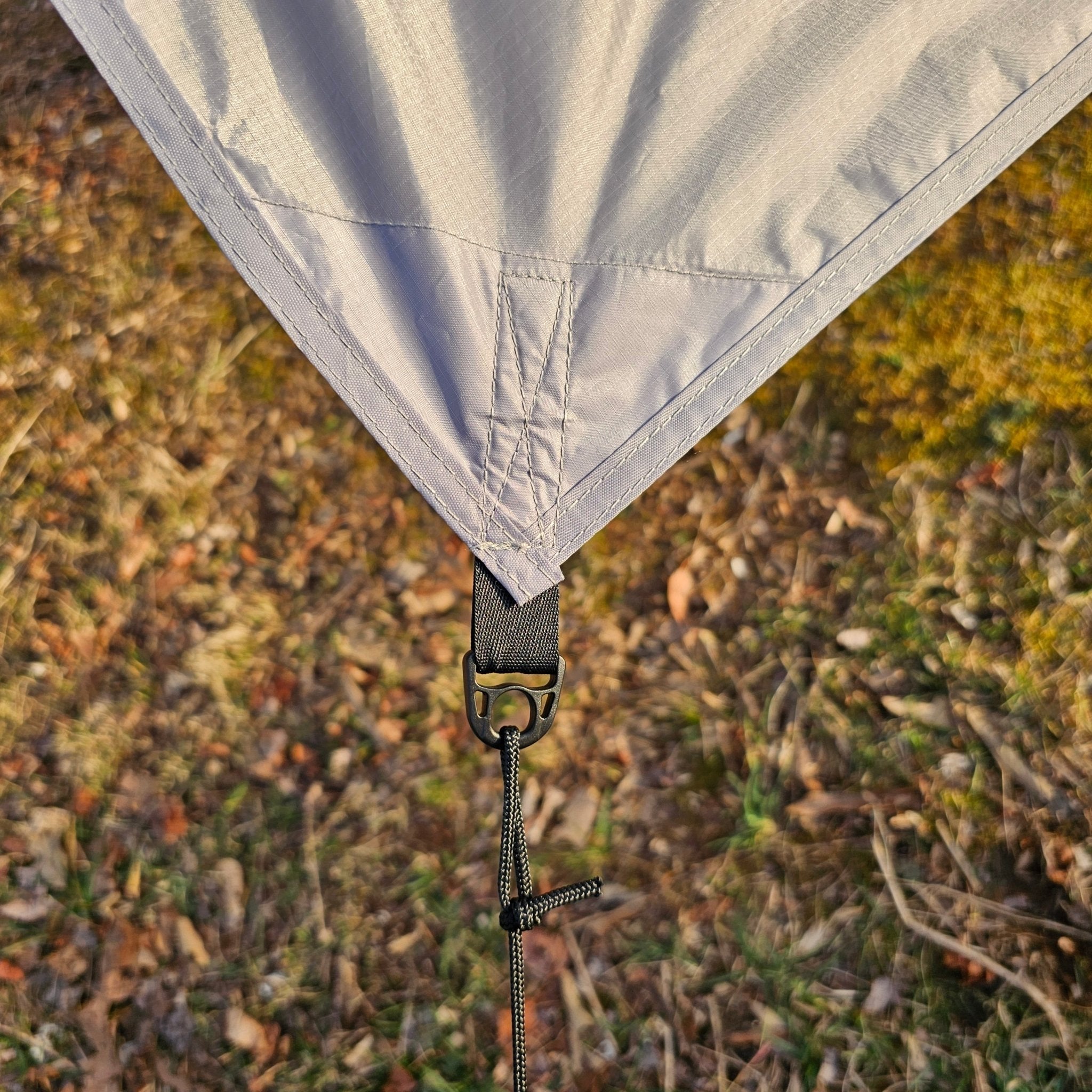 Hanging High Hammocks waterproof 11-foot hammock tarp canopy providing durable, weather-resistant coverage for hammock camping.