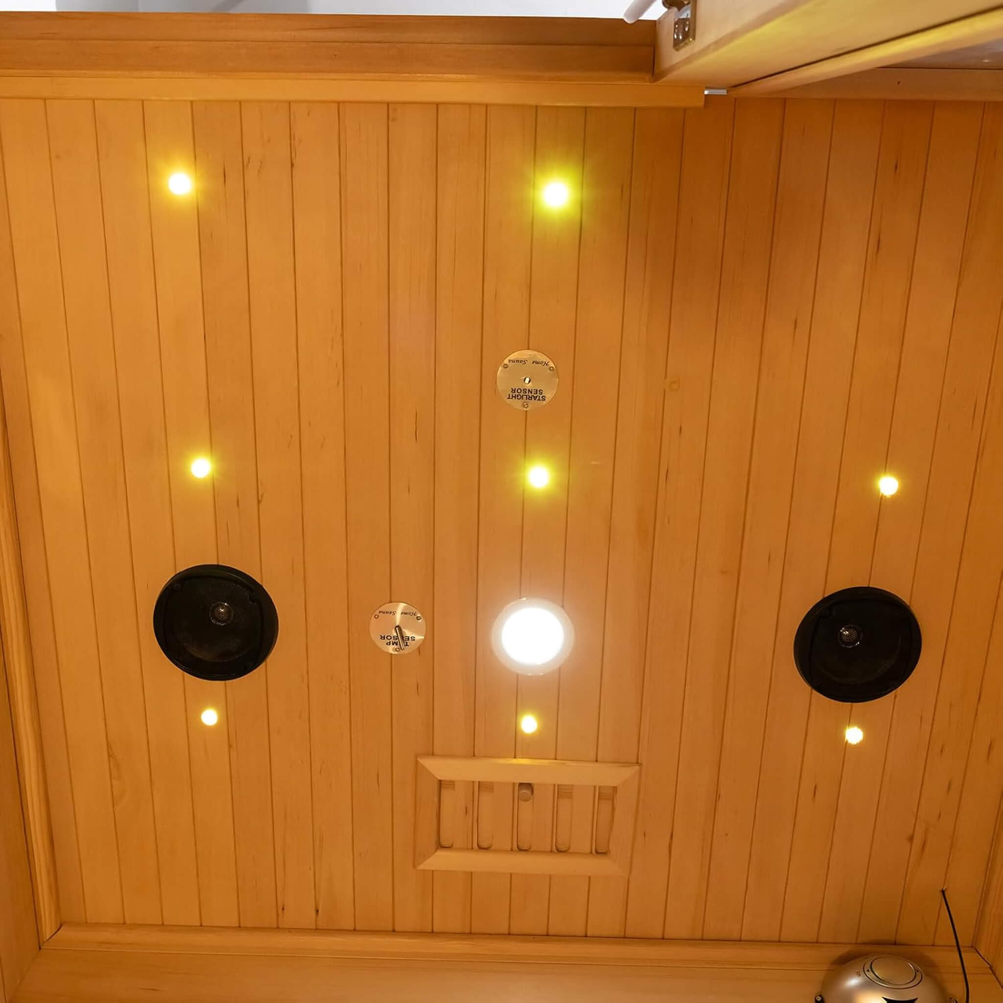Rövia Luma 2-person indoor sauna room with infrared panels and a 3.5KW steam heater, featuring a ceiling design and modern interior.