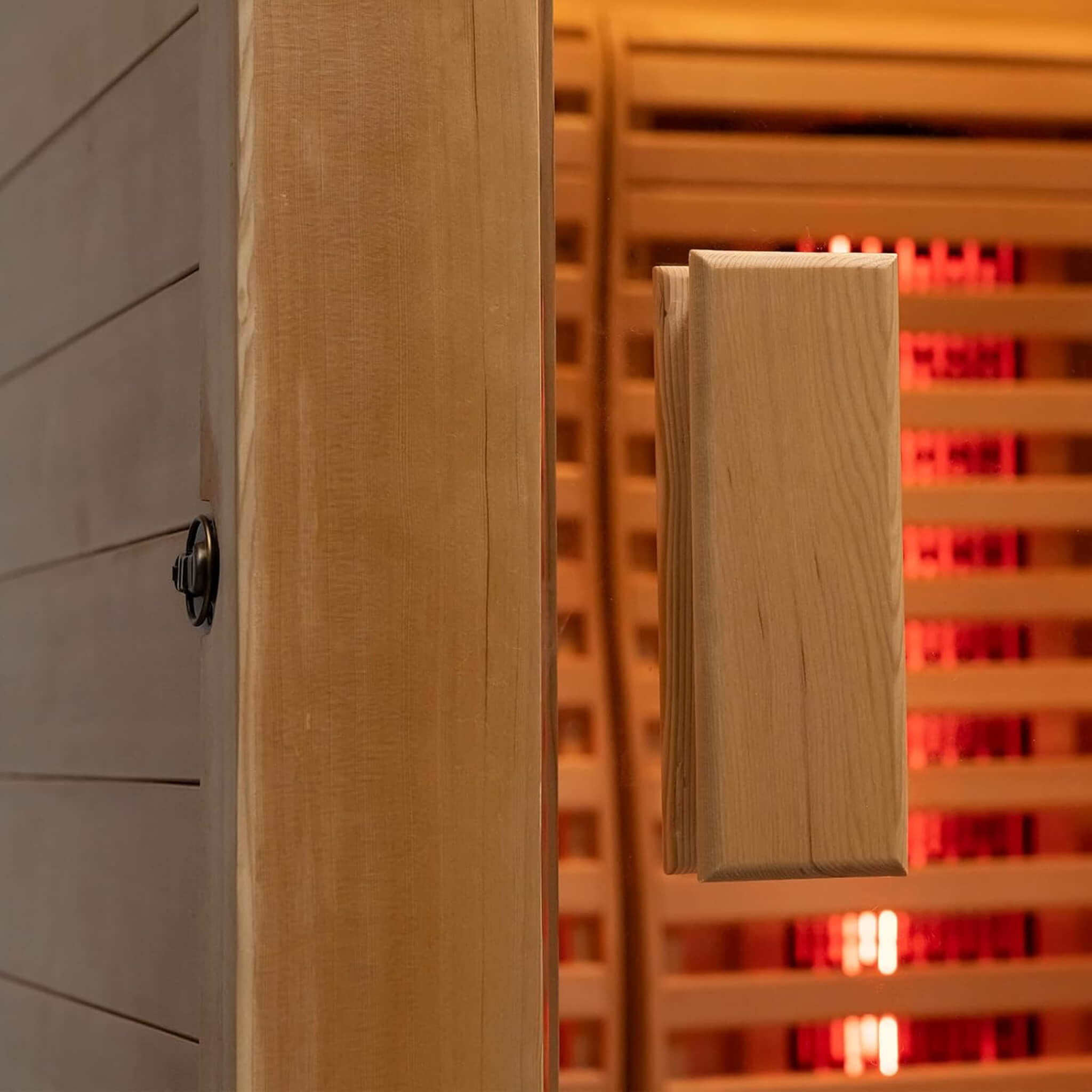 Rövia Luma 2-person indoor sauna with infrared panels and 3.5KW steam heater, featuring glass door and wooden interior.