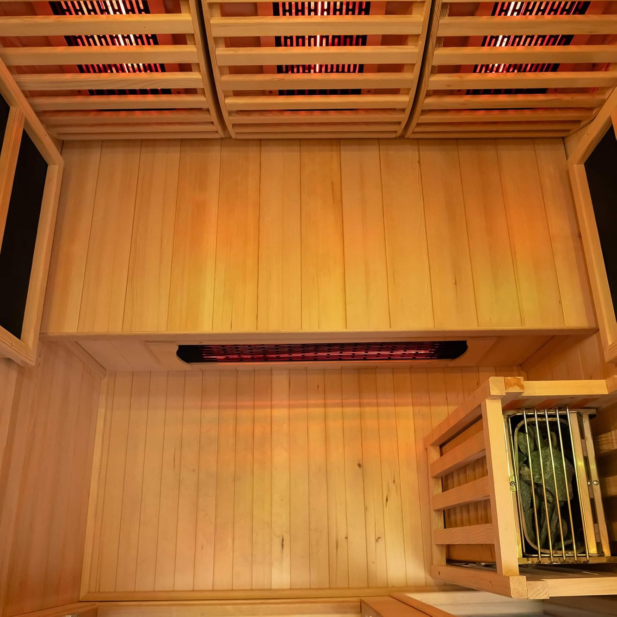 Interior view of Rövia Luma 2-Person Indoor Hybrid Sauna with infrared panels and steam heater, showing wooden benches and control panel.