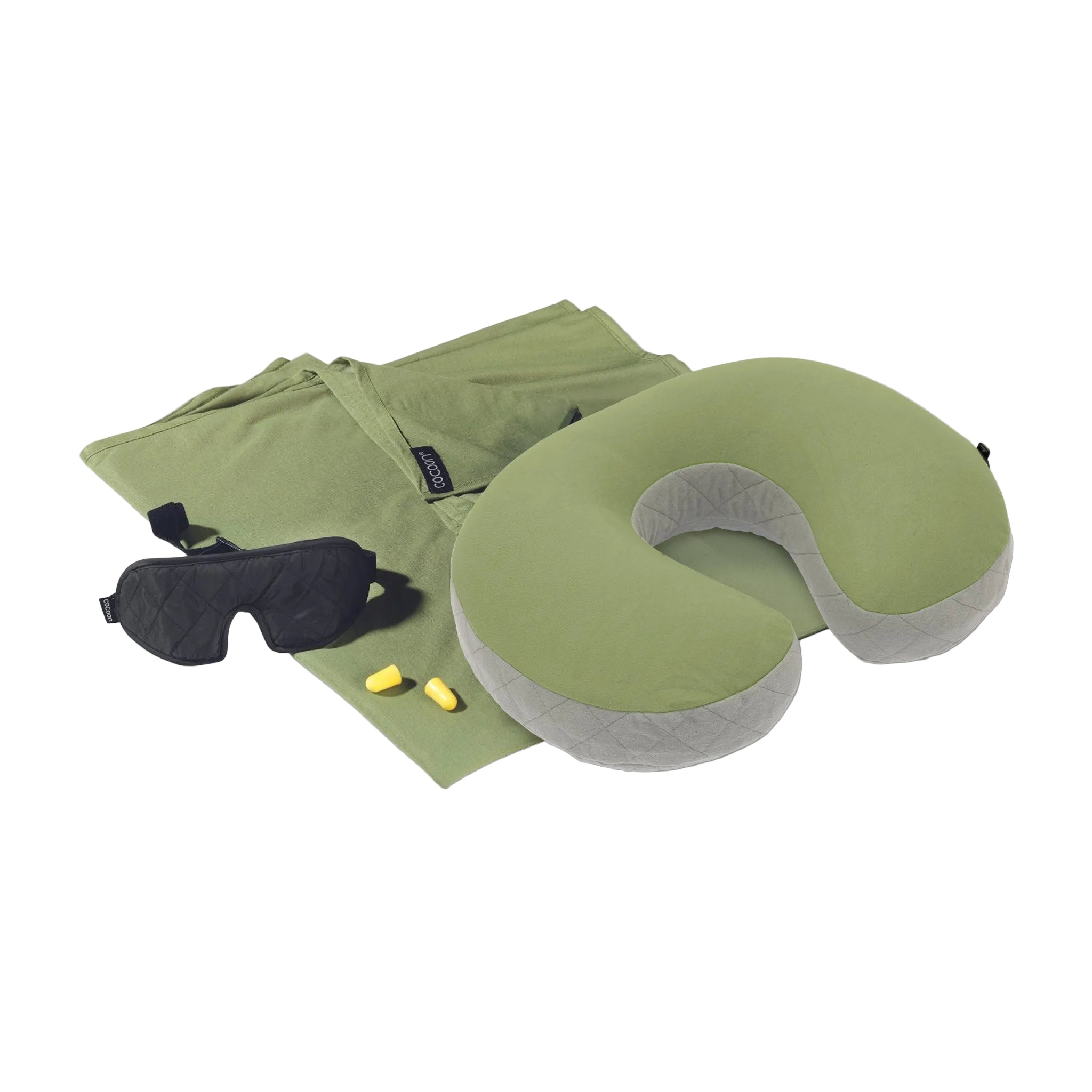 Travel pillow, eye mask, and earplugs on a white background
