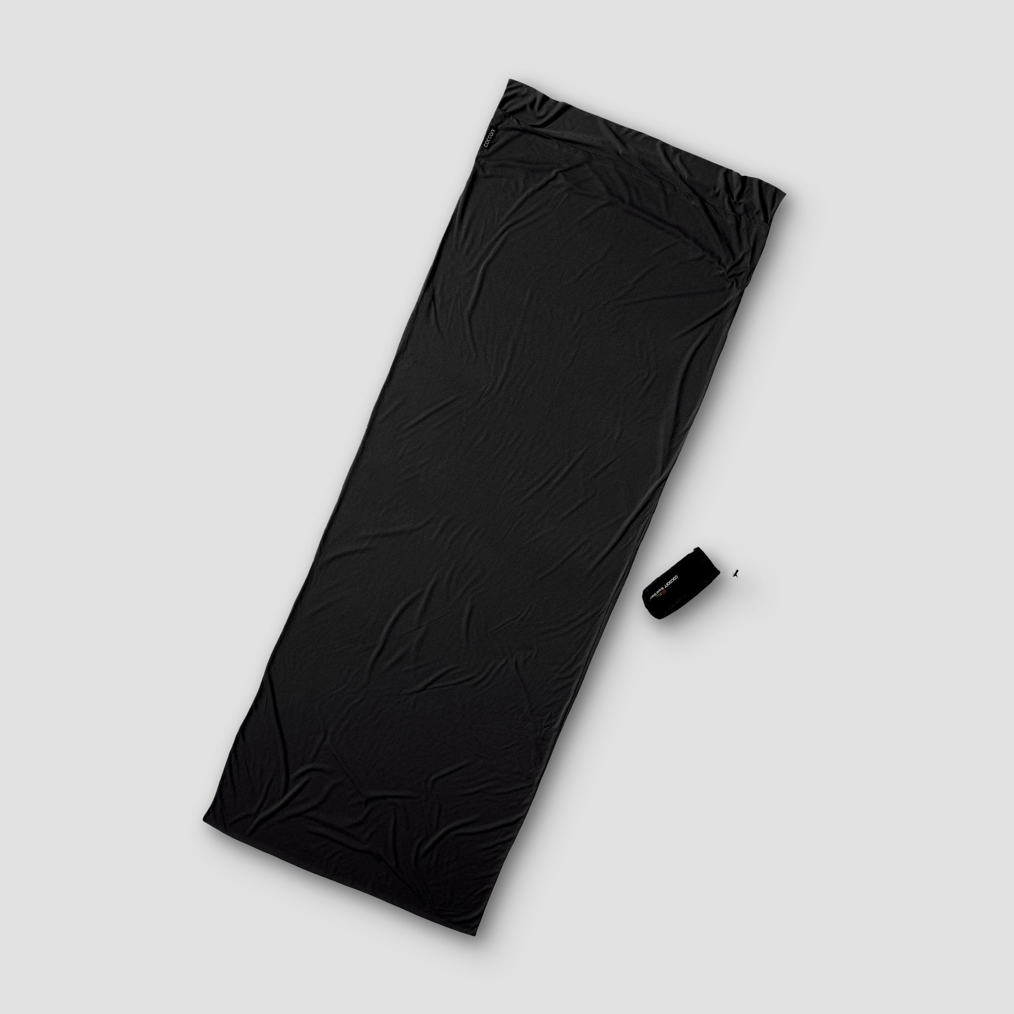 COCOON TravelSheet™ Performer® Thermolite® sleeping bag liner in lightweight, breathable fabric with a zipper closure.