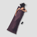 COCOON TravelSheet™ Performer® Thermolite® sleeping bag liner in a compact, lightweight design for travel and camping comfort.