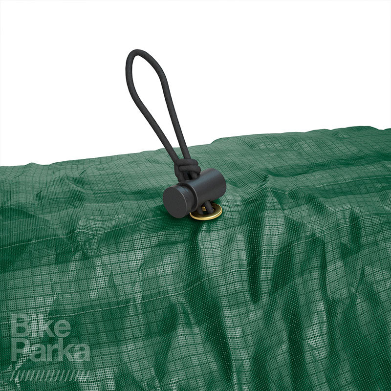 Forest green ZEITBIKE BikeParka cargo bicycle cover protecting a bike from weather elements outdoors.