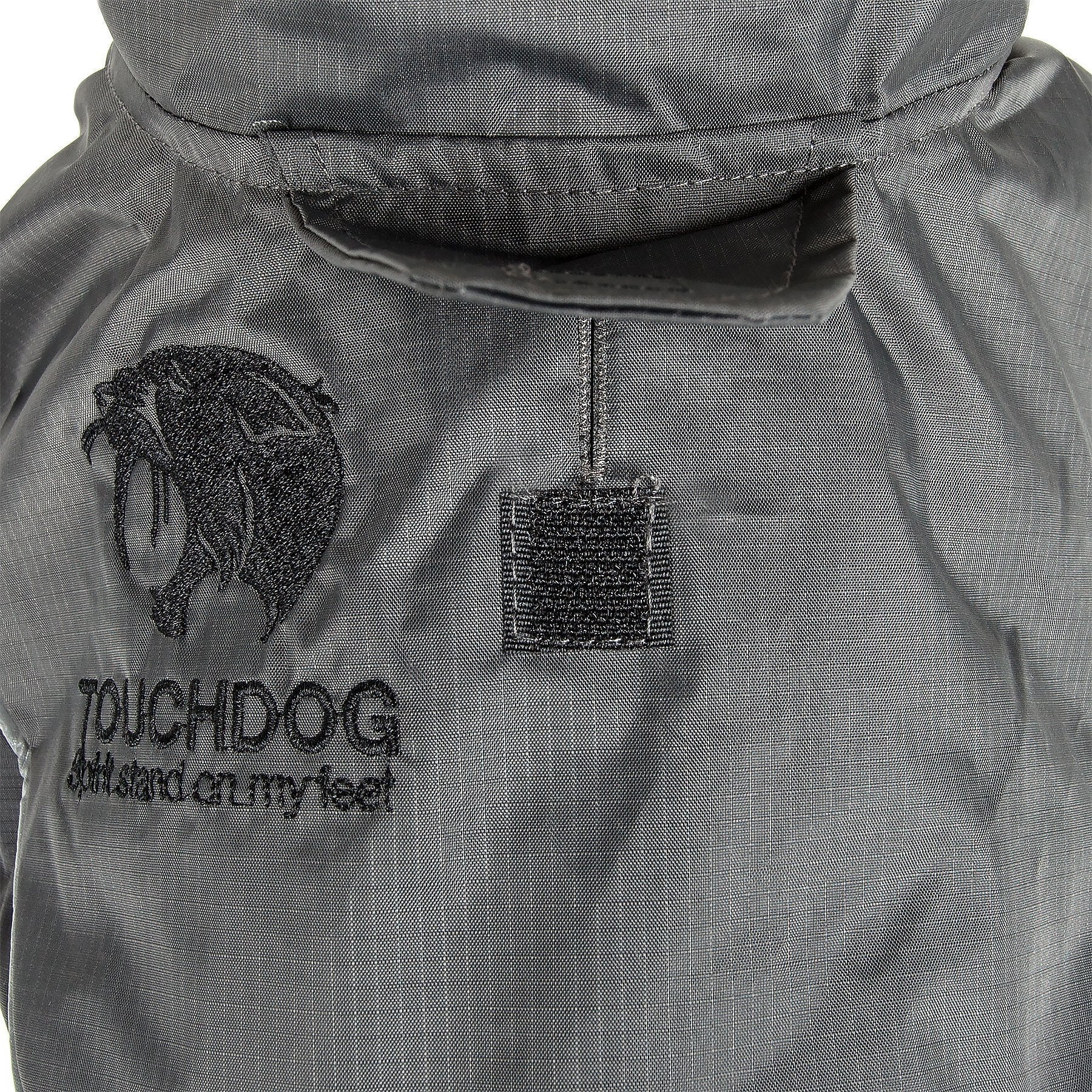 Pet Life Touchdog Lightening-Shield 2-in-1 waterproof dog jacket with removable layers, black shark technology, for versatile outdoor wear.
