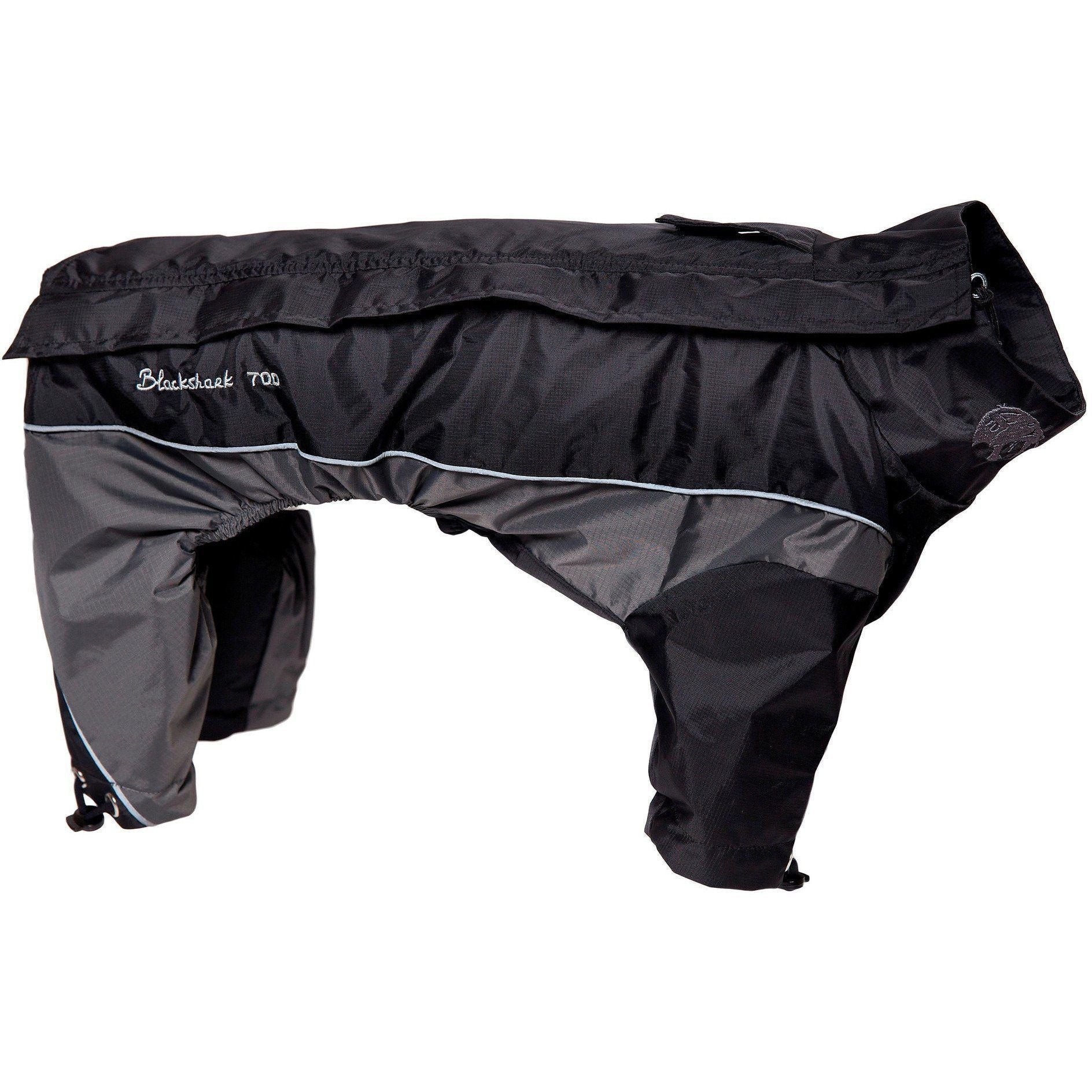 Black dog wearing Touchdog Quantum-Ice full-body winter jacket, featuring adjustable fit and reflective elements.