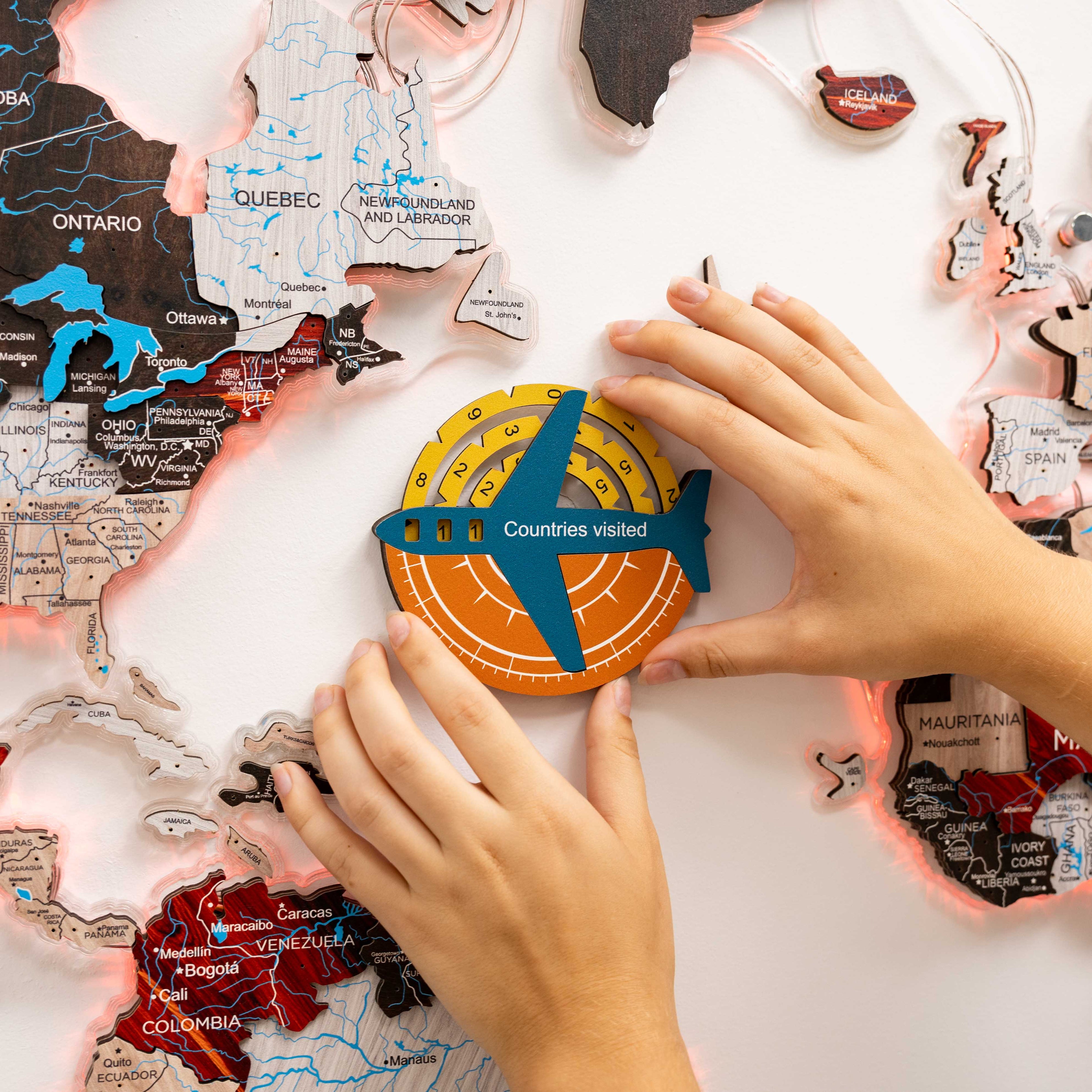 Enjoy The Wood Travel Tracker 3D colored wooden world map with detailed continents and vibrant colors for tracking travels.