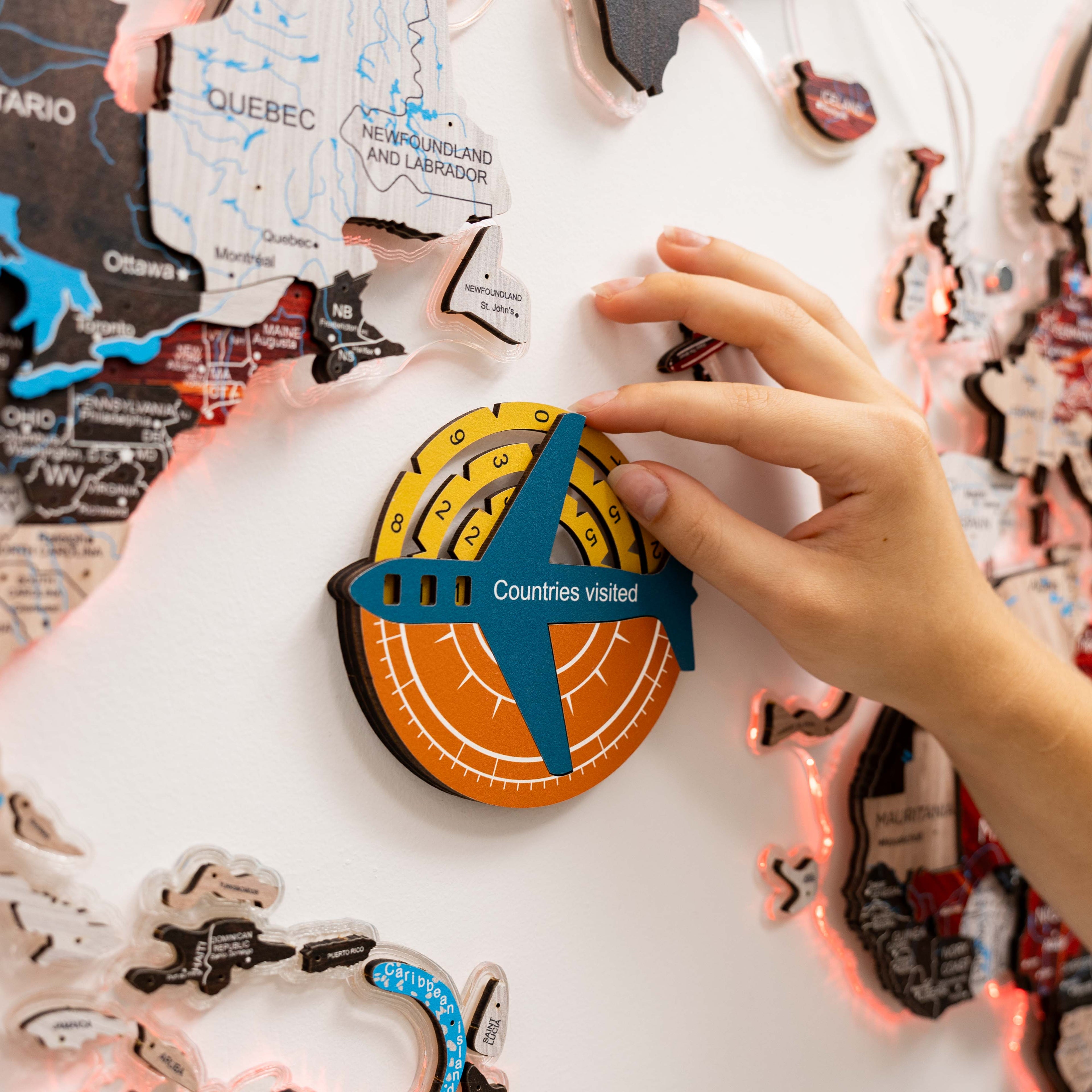 Enjoy The Wood Travel Tracker 3D colored wooden world map displaying a detailed, vibrant map with travel tracking markers.