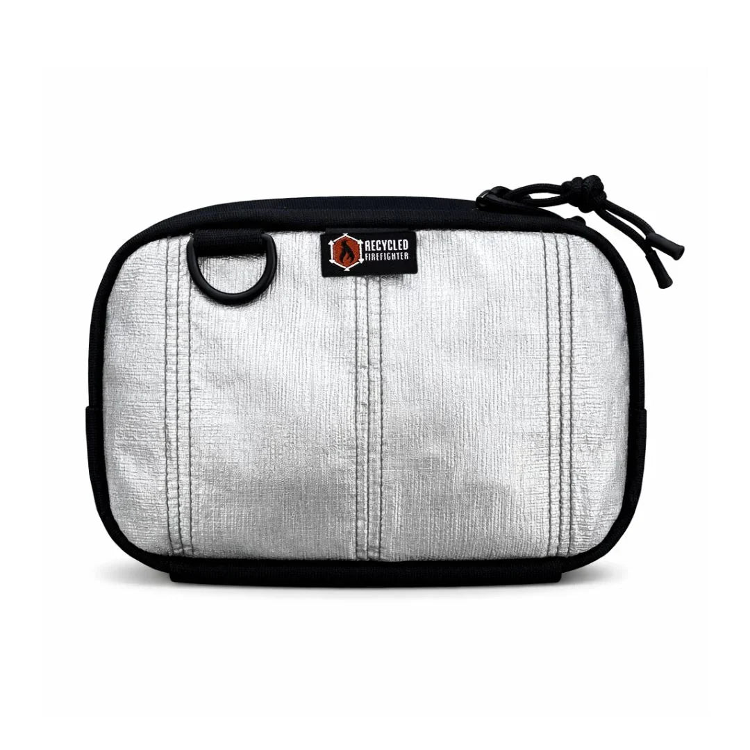 Recycled Firefighter TrailHound Fanny Pack Bunker Gear Edition in silver, durable and lightweight for outdoor adventures.