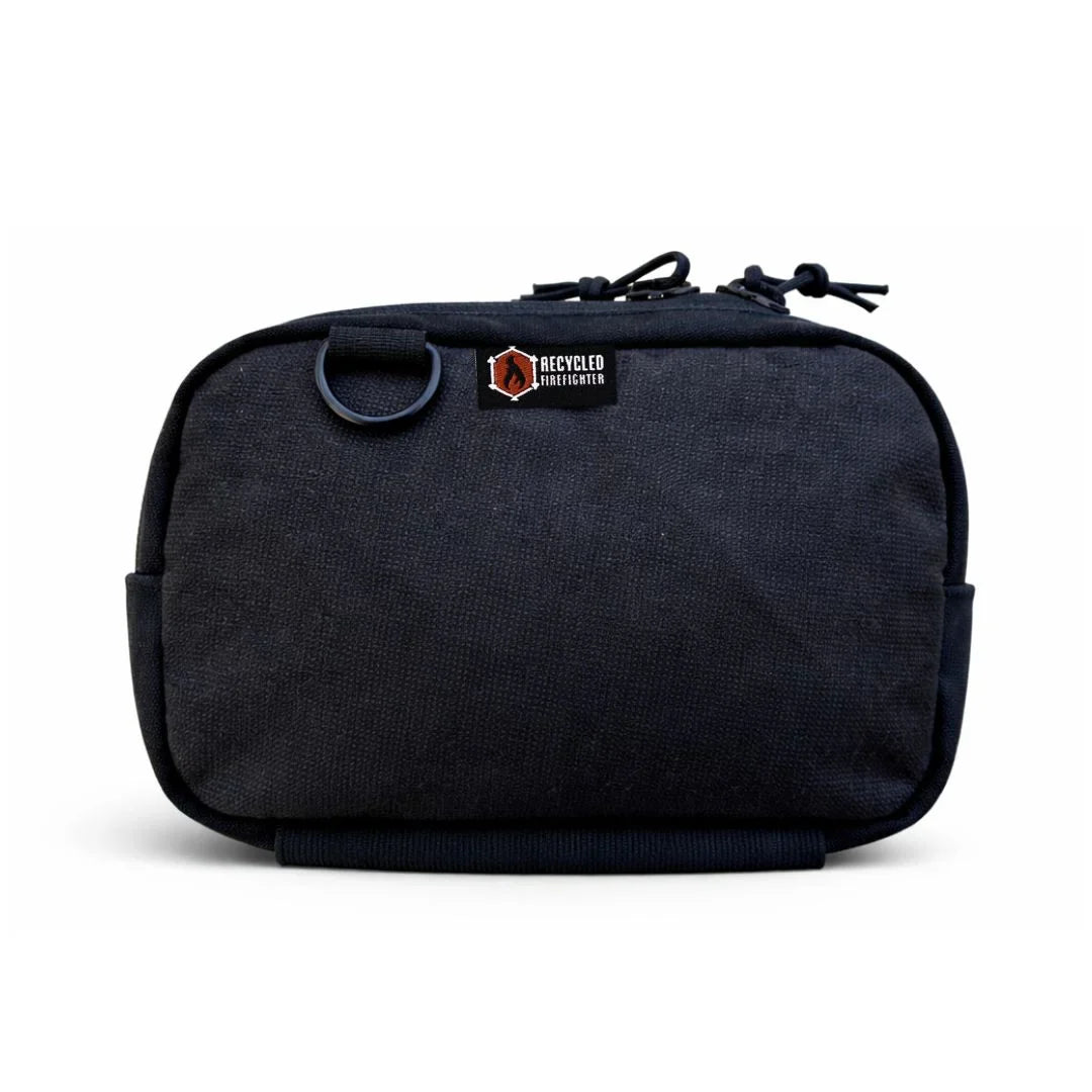 Recycled Firefighter TrailHound Fanny Pack Bunker Gear Edition in black with adjustable strap and multiple storage compartments.