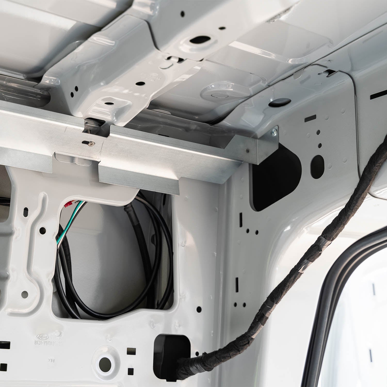 Timber Van Kits transit van panel structure assembly with metal framing and wood panels for van interior conversion.