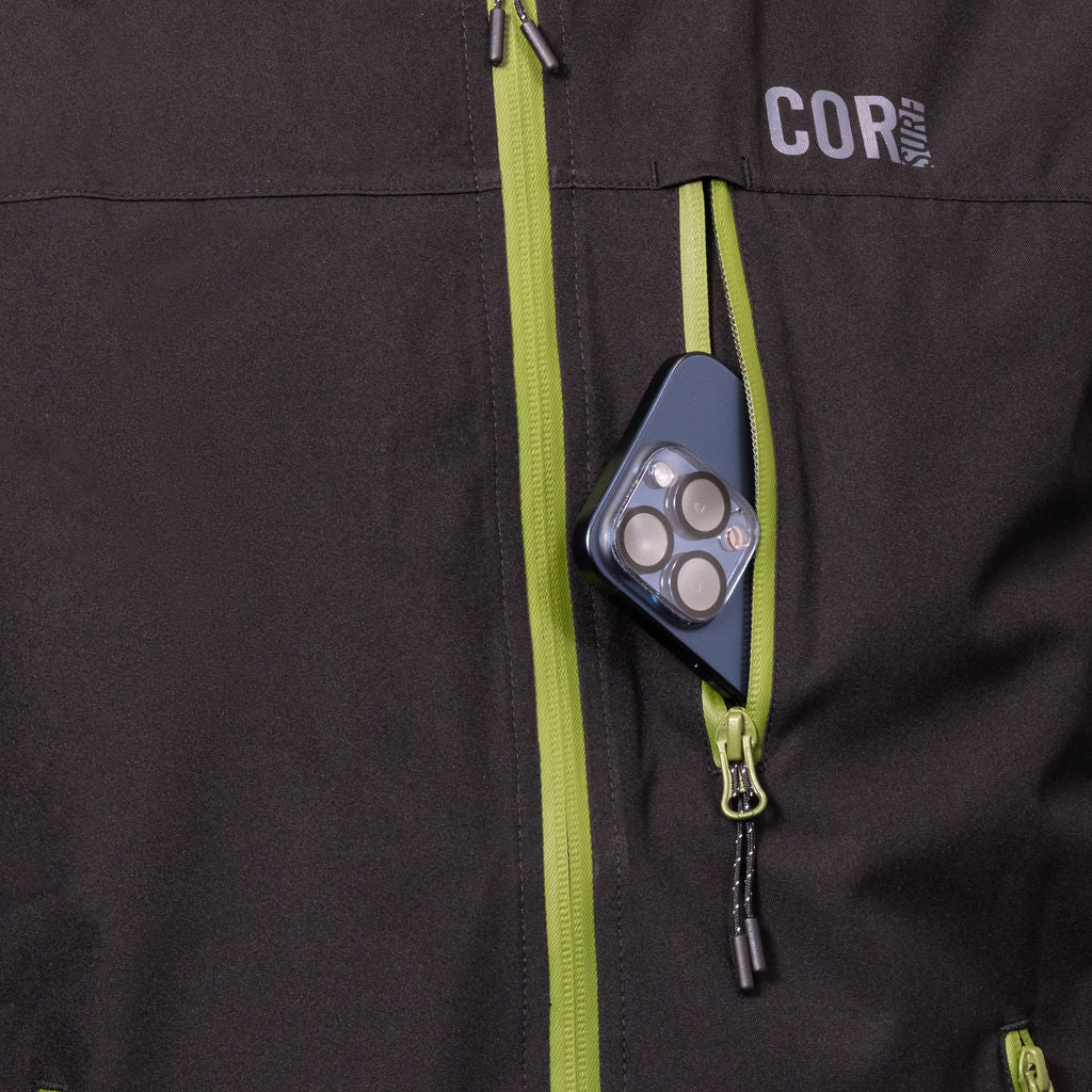 Unisex COR Surf Huakai Travel Rain Jacket with chest pocket, lightweight waterproof apparel for outdoor adventures.
