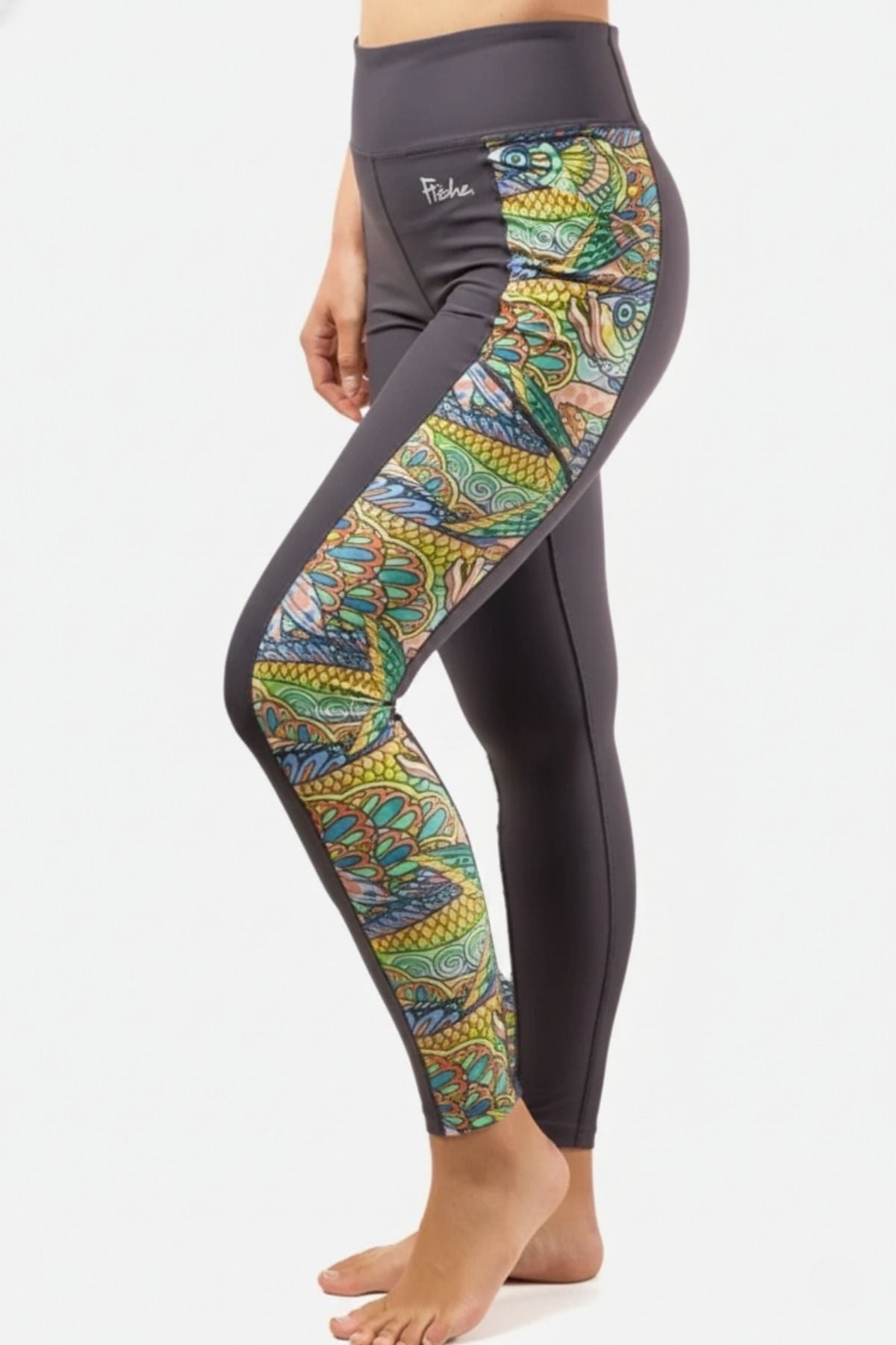 FisheWear Tropical Tarpon Pocket Leggings featuring vibrant tropical fish and palm leaf patterns, perfect for active and casual wear.