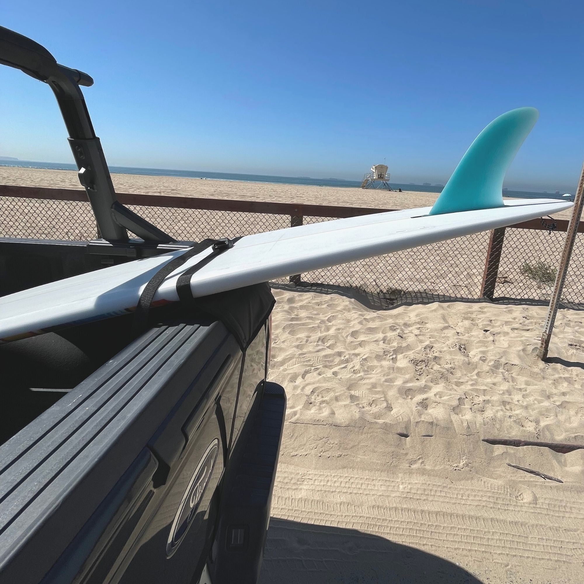 COR Surf tailgate truck pad for surfboards and paddleboards, providing secure cushioning on truck tailgates during transport.