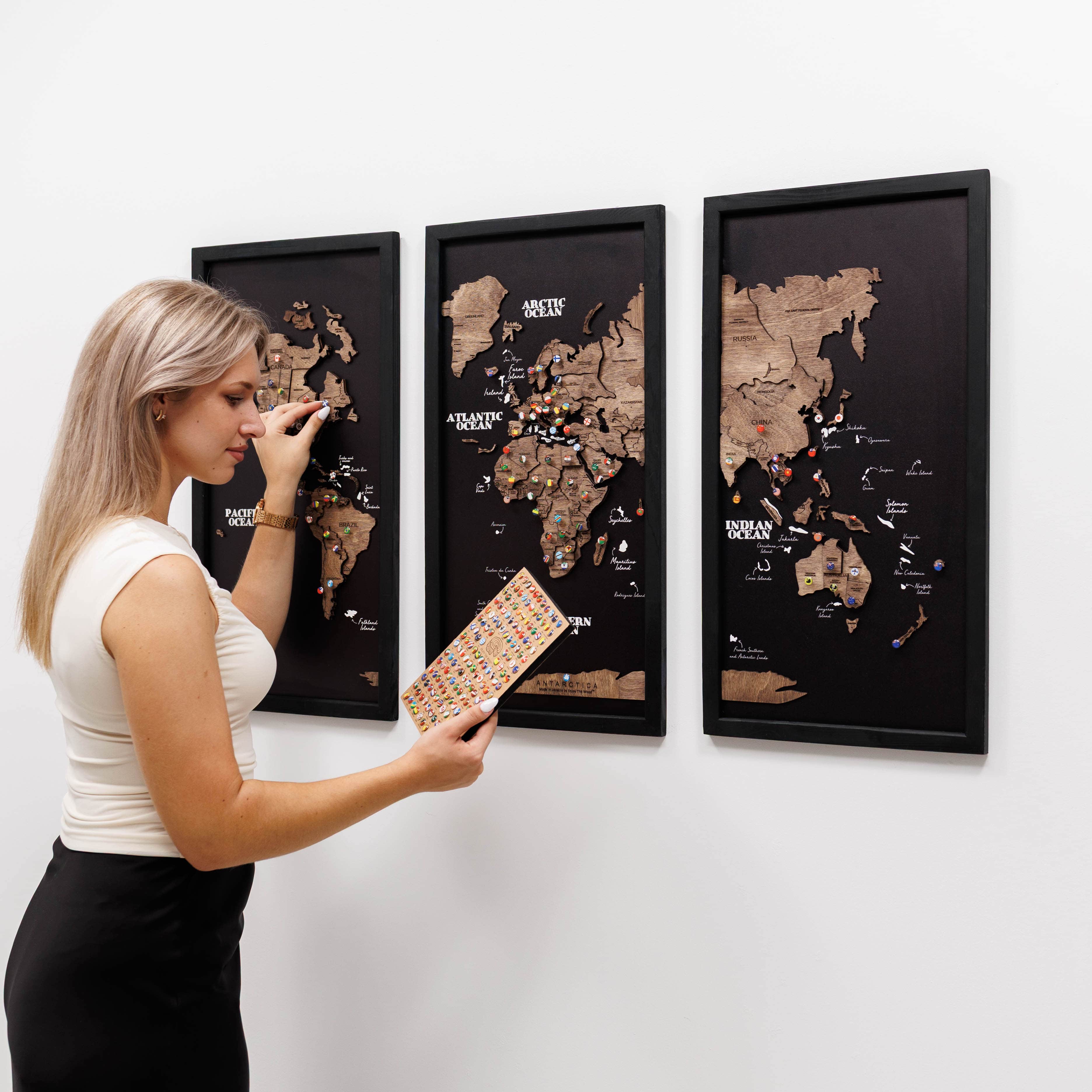 Dark walnut wooden triptych world map by Enjoy The Wood, showcasing a detailed, three-panel design suitable for wall decor.