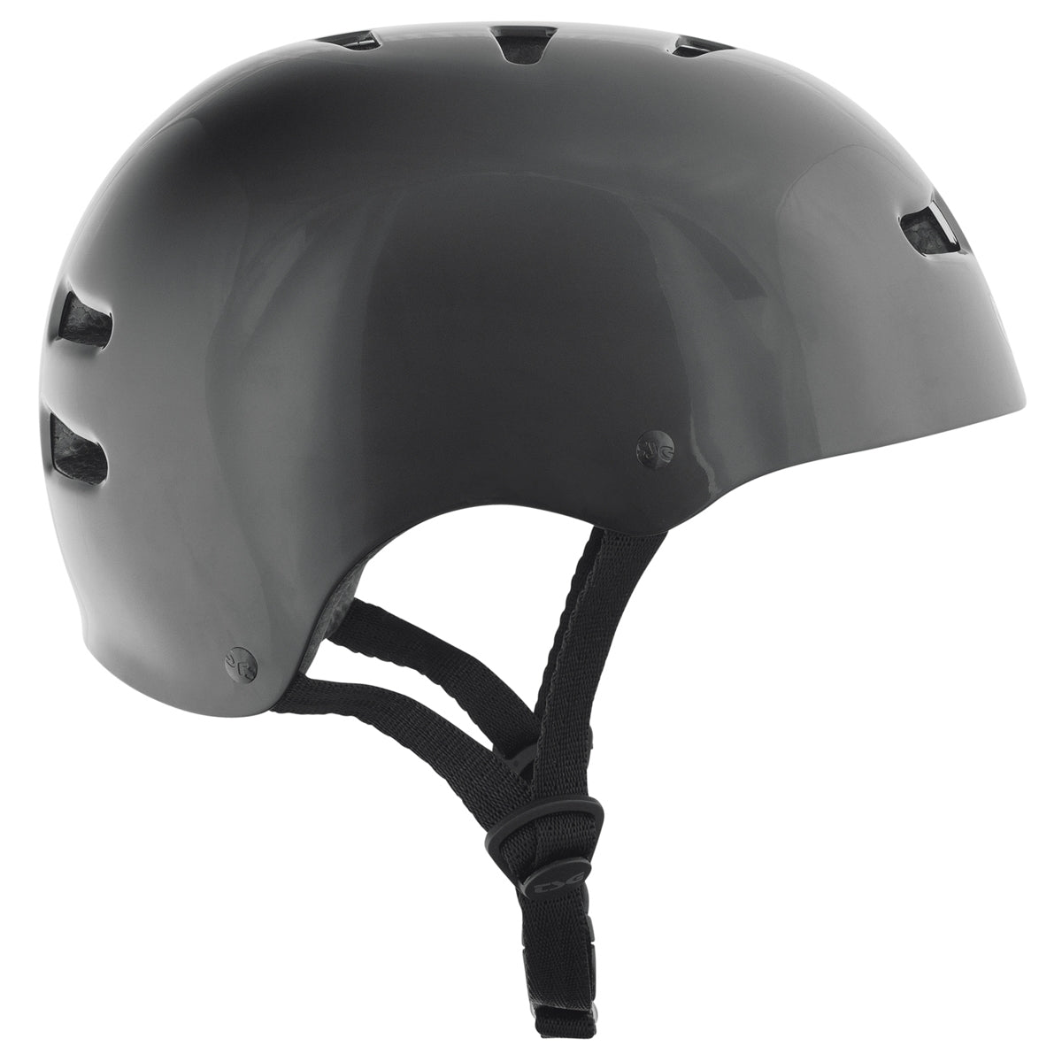 Black injected TSG Skate/BMX helmet with adjustable straps and ventilation for safety and comfort during riding.